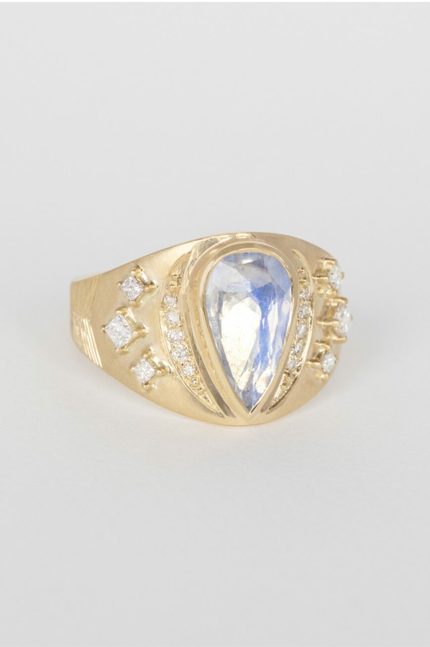 Gold signet ring pear moonstone diamond accents engraved band Céline Daoust