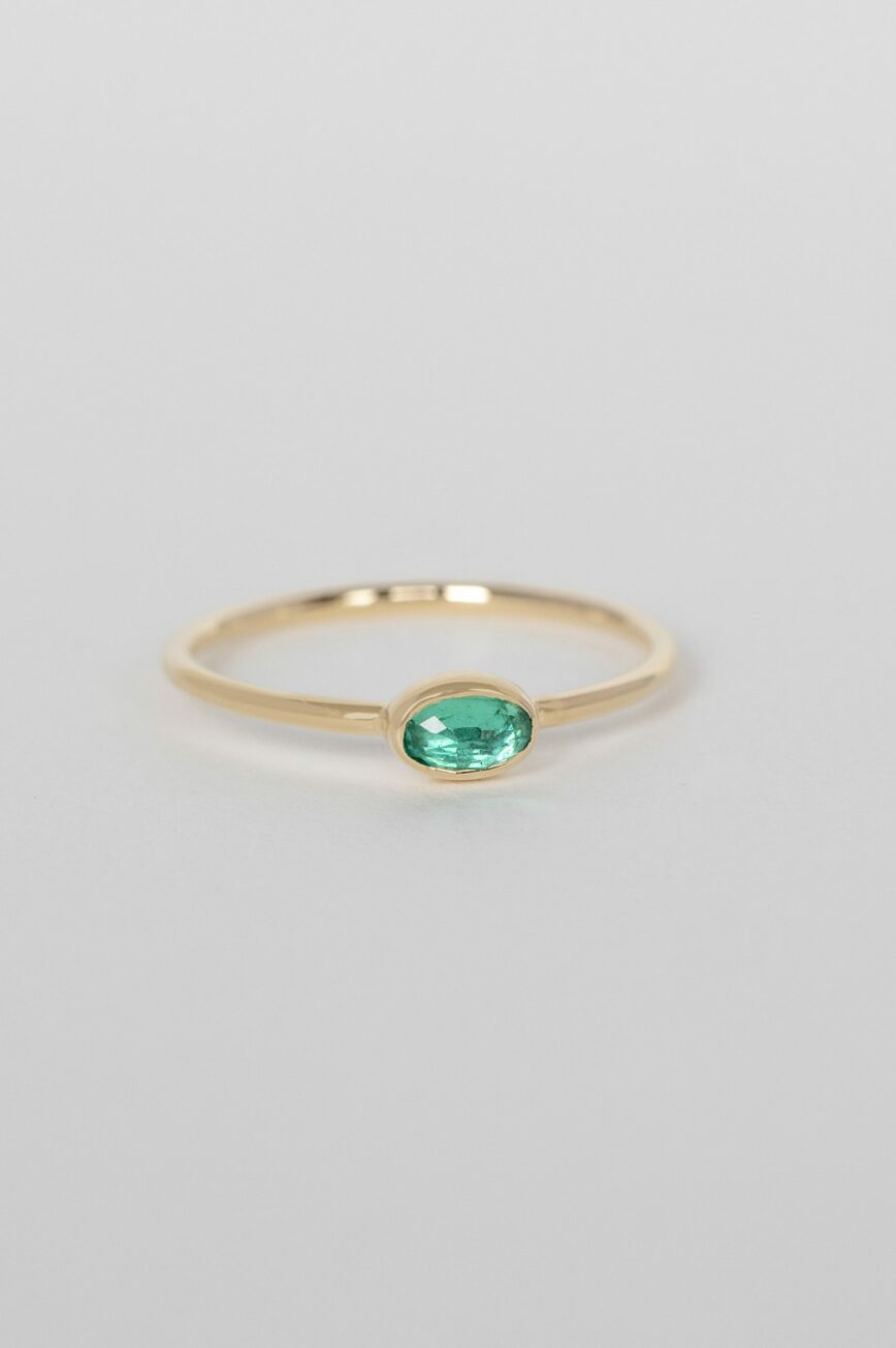 Yellow gold ring oval emerald bezel slim band Celine Daoust