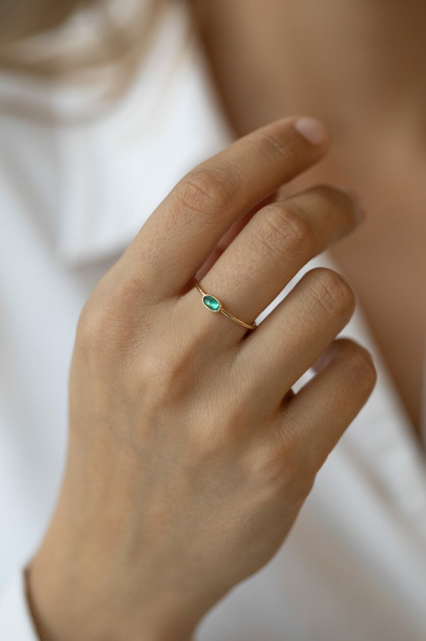 Yellow gold ring oval emerald bezel slim band Celine Daoust