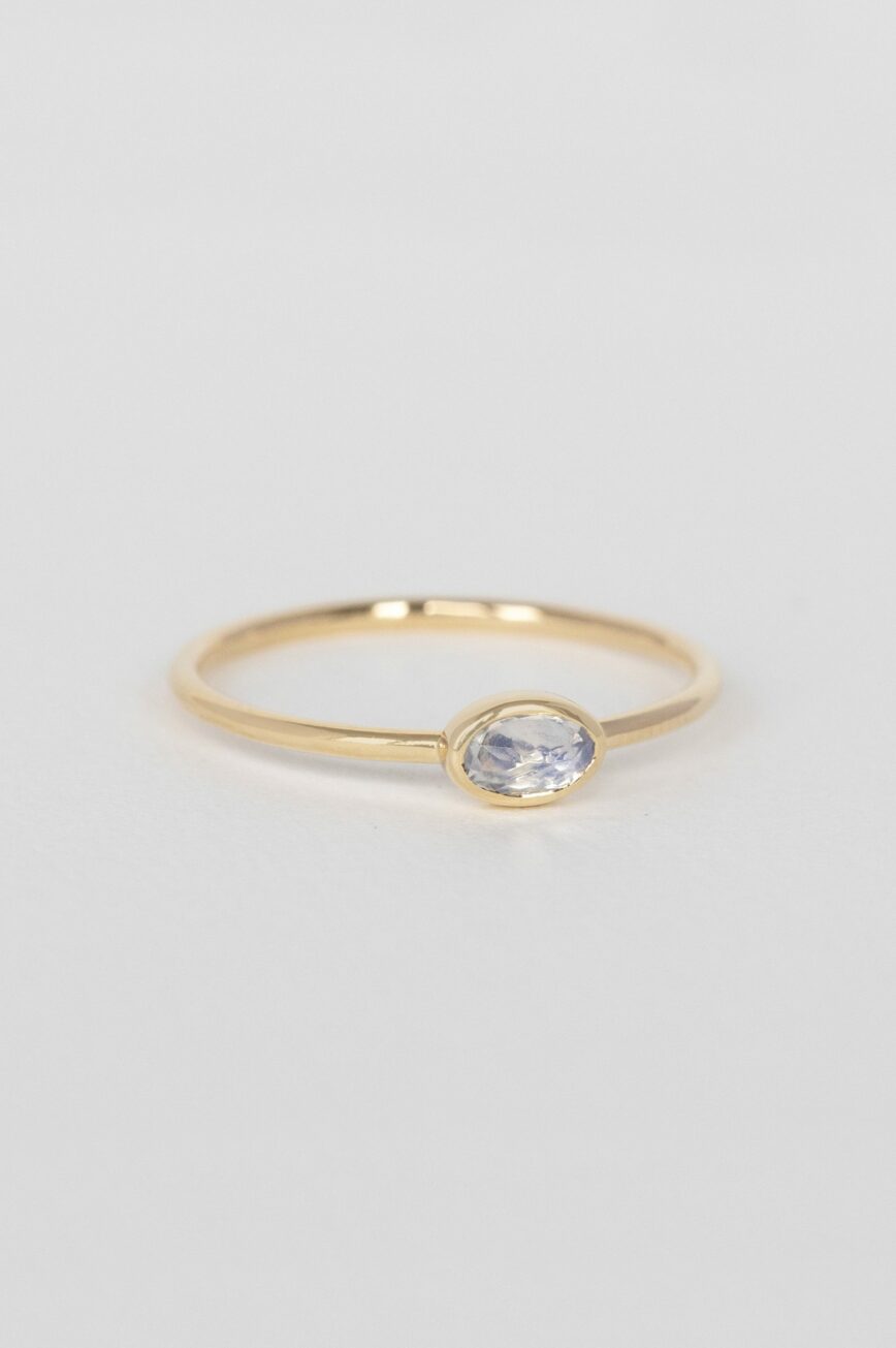 Yellow gold ring oval moonstone bezel slim band Celine Daoust
