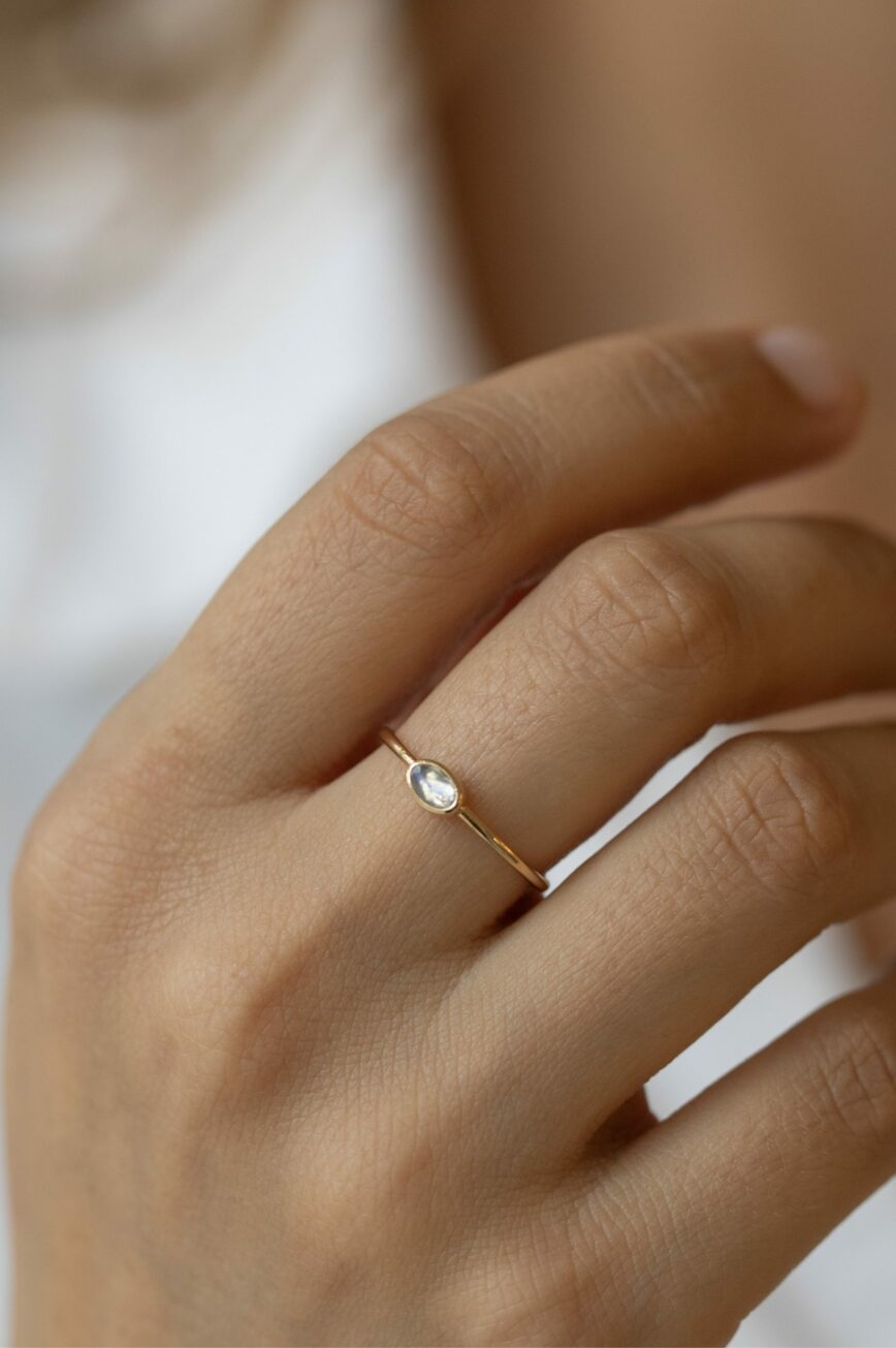 Yellow gold ring oval moonstone bezel slim band Celine Daoust