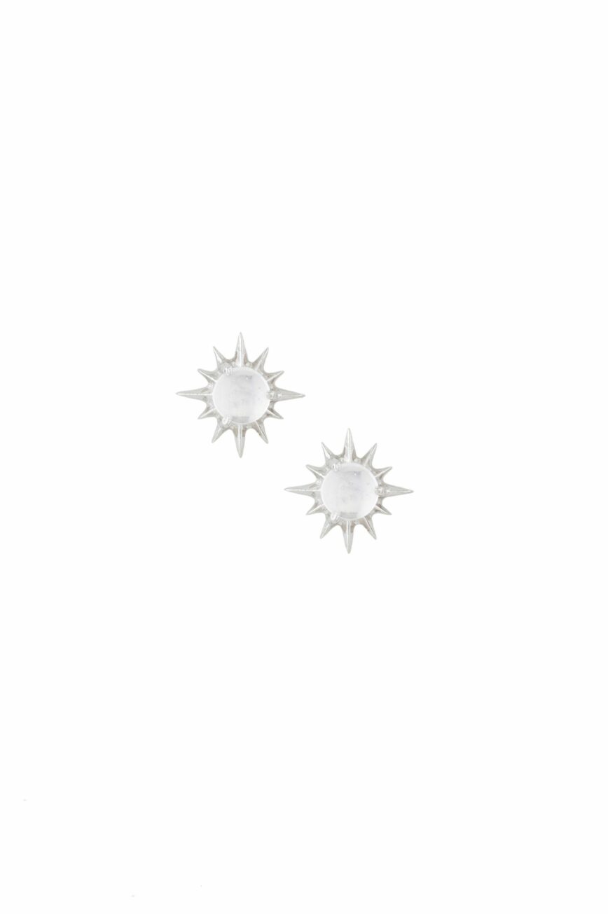 white gold stud earrings each featuring a round moonstone cabochon at center surrounded by radiating spike rays, evoking a celestial sun