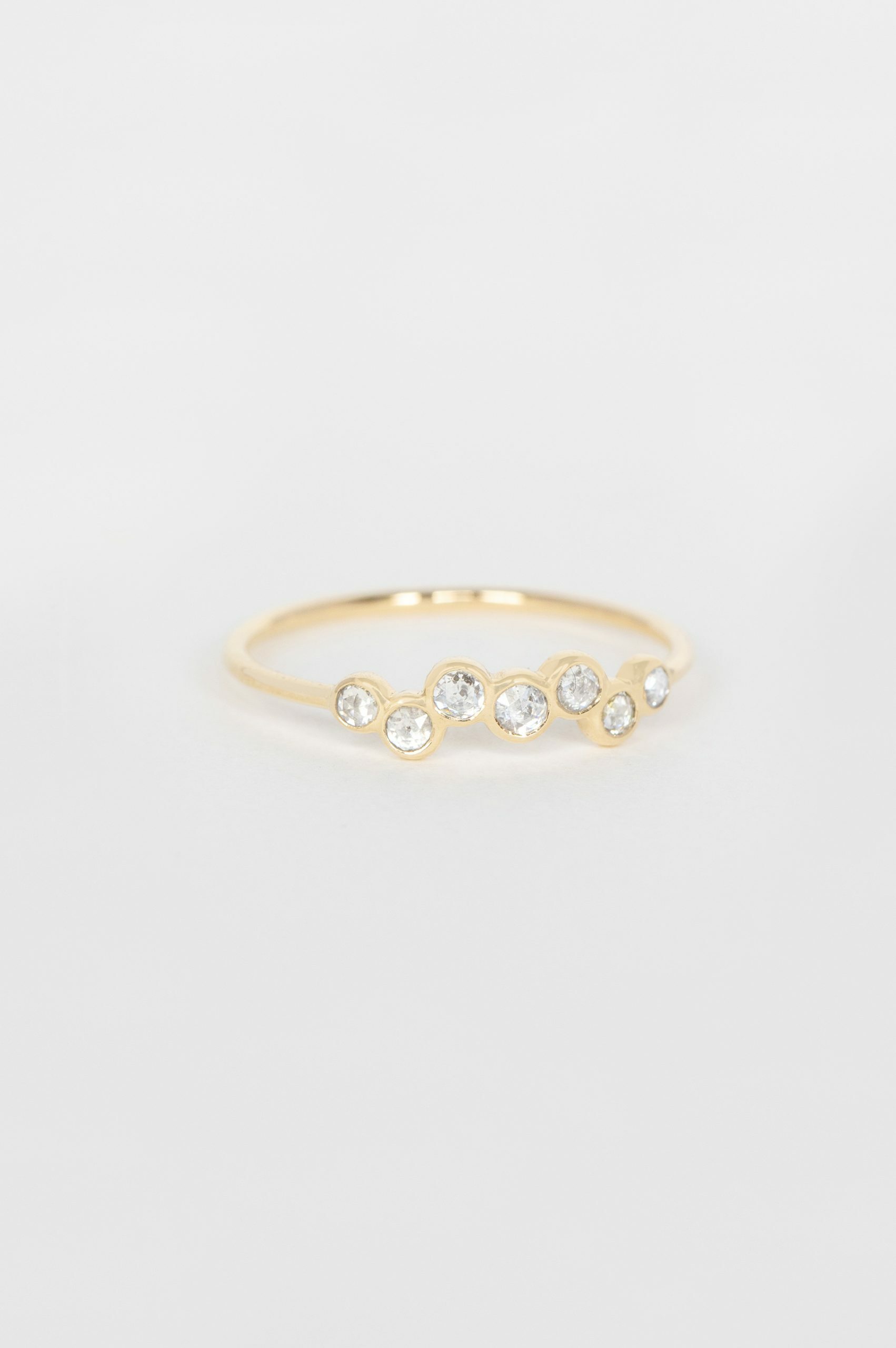 Yellow gold ring multiple grey diamonds bezel set twisted band Celine Daoust