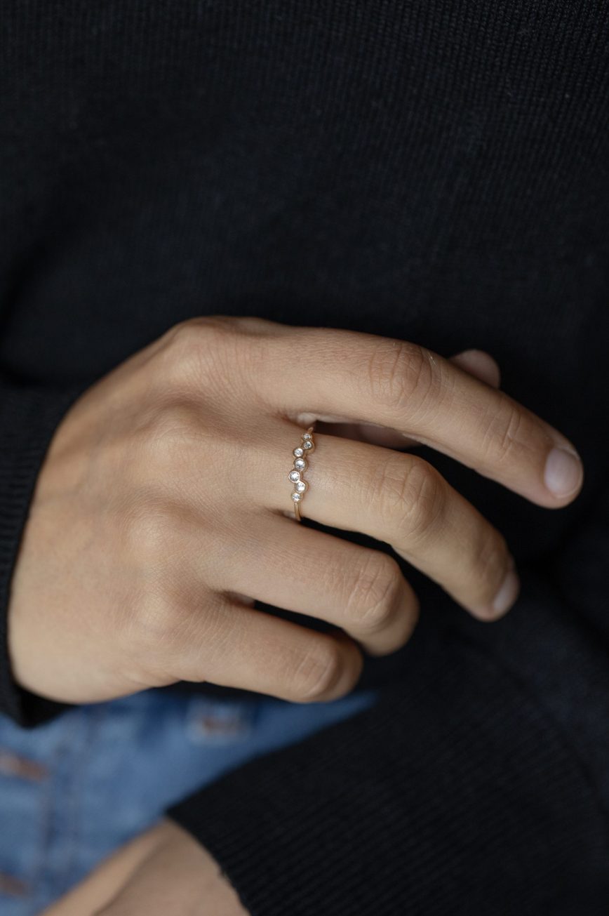 Yellow gold ring multiple grey diamonds bezel set twisted band Celine Daoust