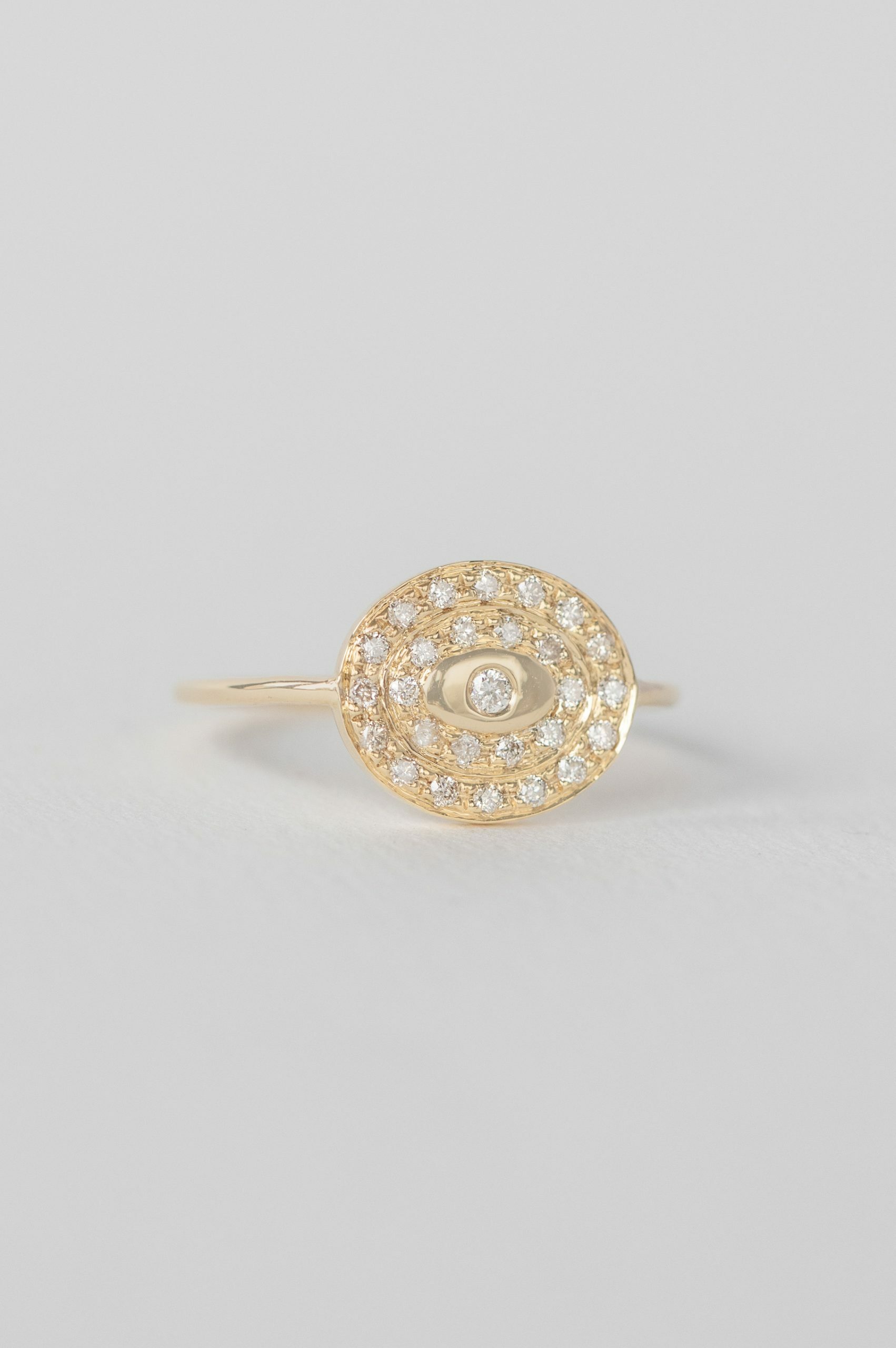 Yellow gold wide ring circular pavé diamond disc eye motif band Celine Daoust