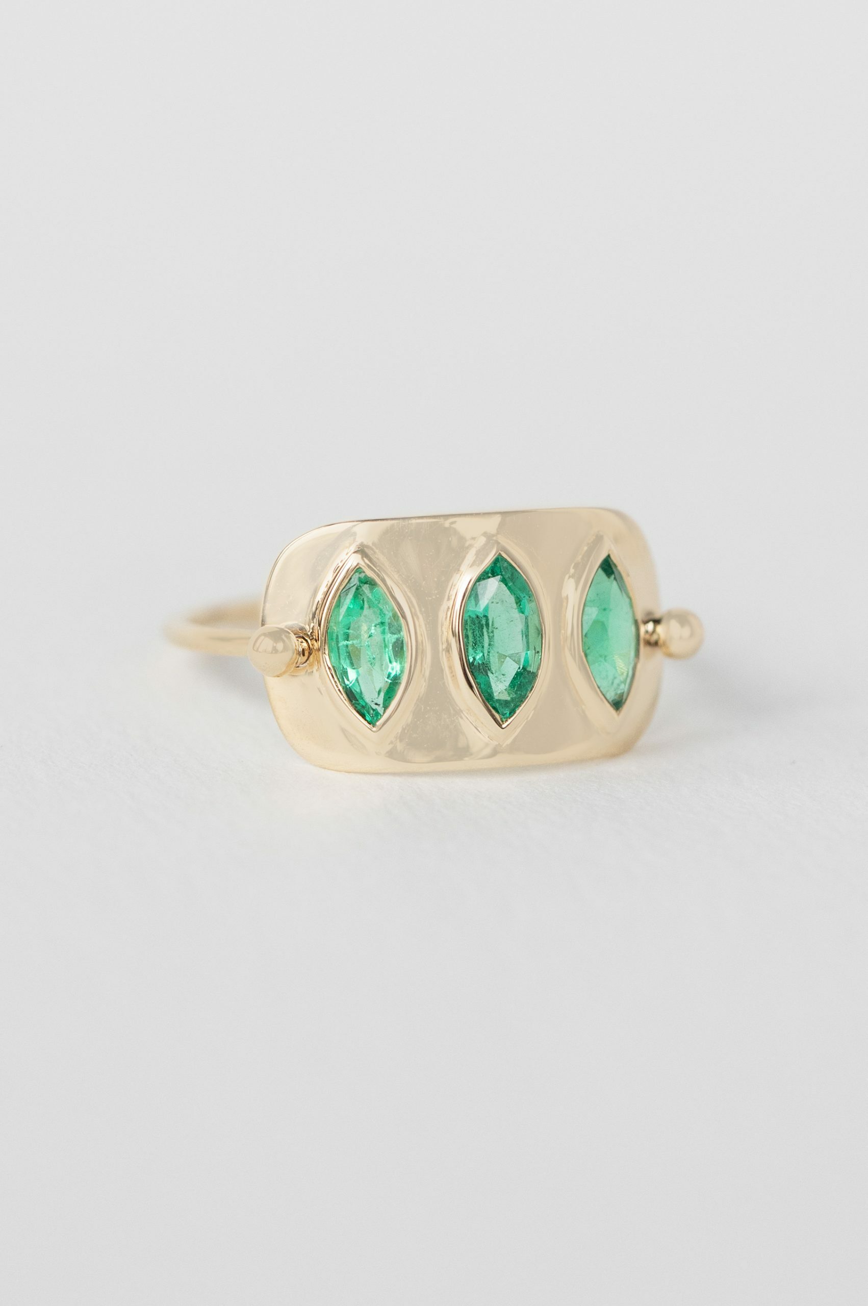Yellow gold wide band ring three marquise emerald bezel set plate Celine Daoust