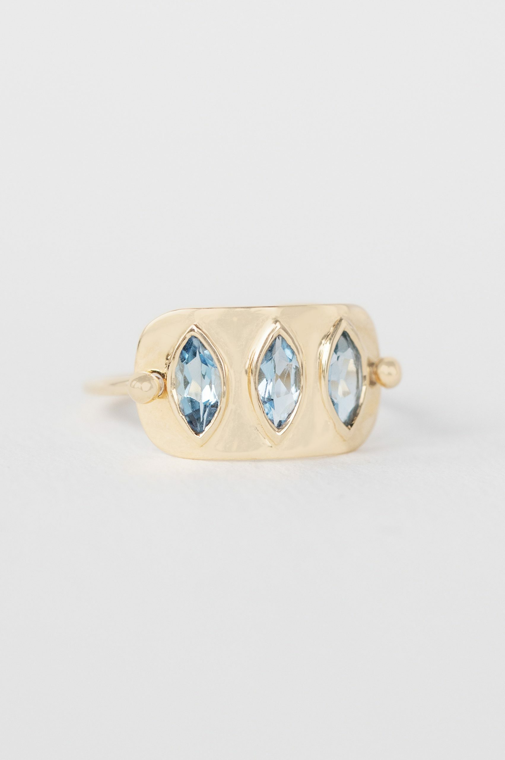Yellow gold wide band ring three marquise aquamarine bezel set plate Celine Daoust