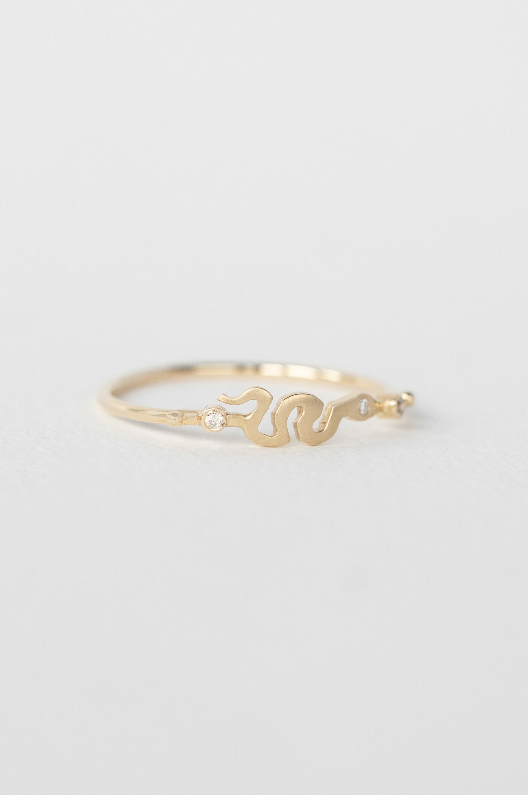 Yellow gold ring sculpted snake motif diamond accent slim band Celine Daoust