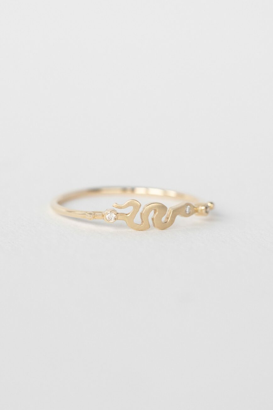 Yellow gold ring sculpted snake motif diamond accent slim band Celine Daoust
