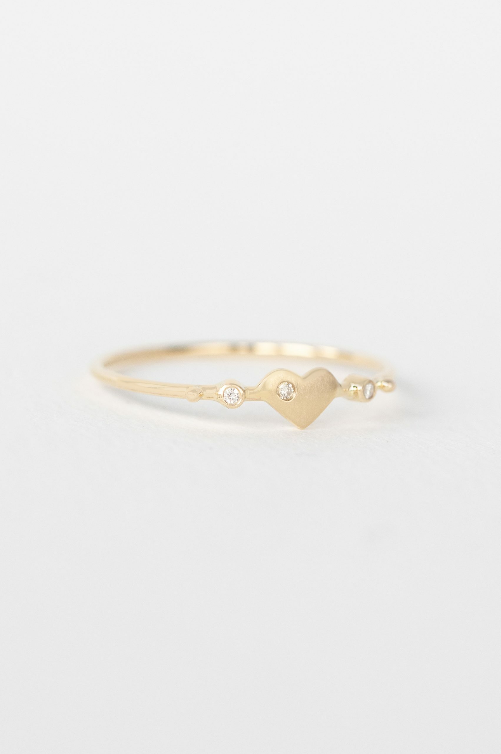 Yellow gold ring sculpted heart motif diamond accent slim band Celine Daoust