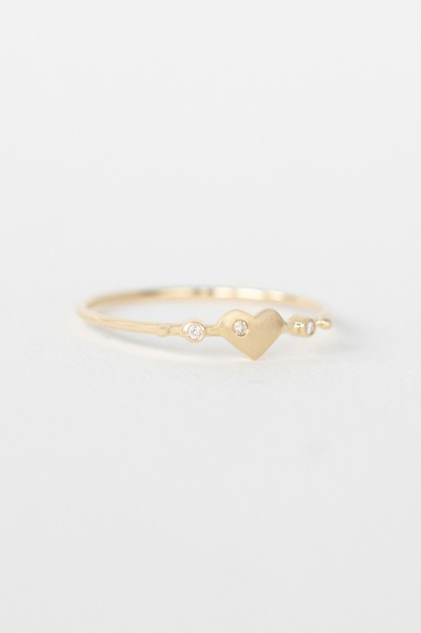Yellow gold ring sculpted heart motif diamond accent slim band Celine Daoust