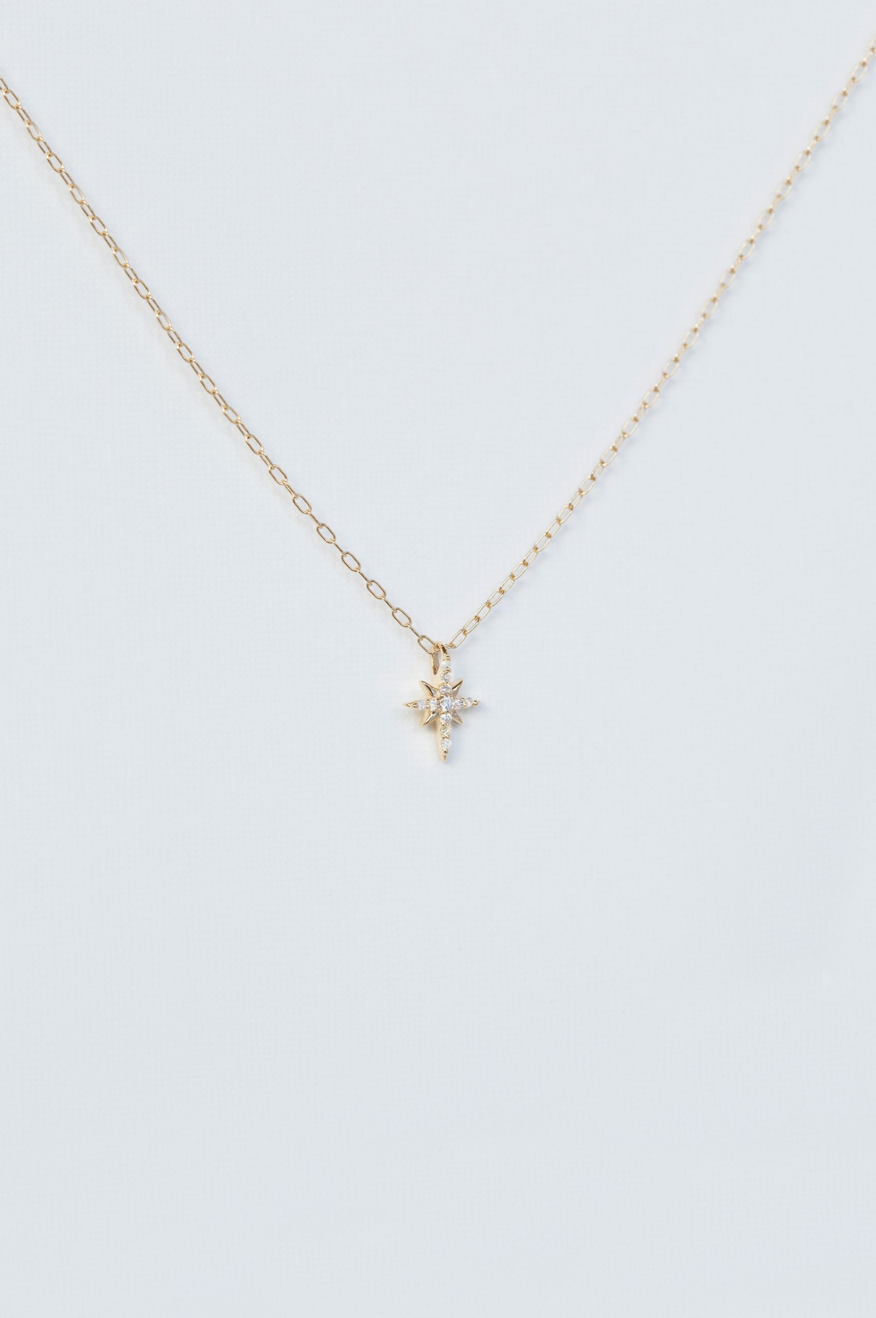 Yellow gold necklace north star diamond pendant delicate chain Celine Daoust