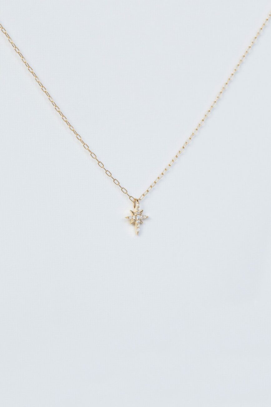 Yellow gold necklace north star diamond pendant delicate chain Celine Daoust