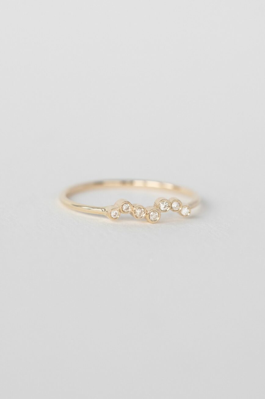 Yellow gold ring multiple bezel-set diamonds twisted slim band Celine Daoust
