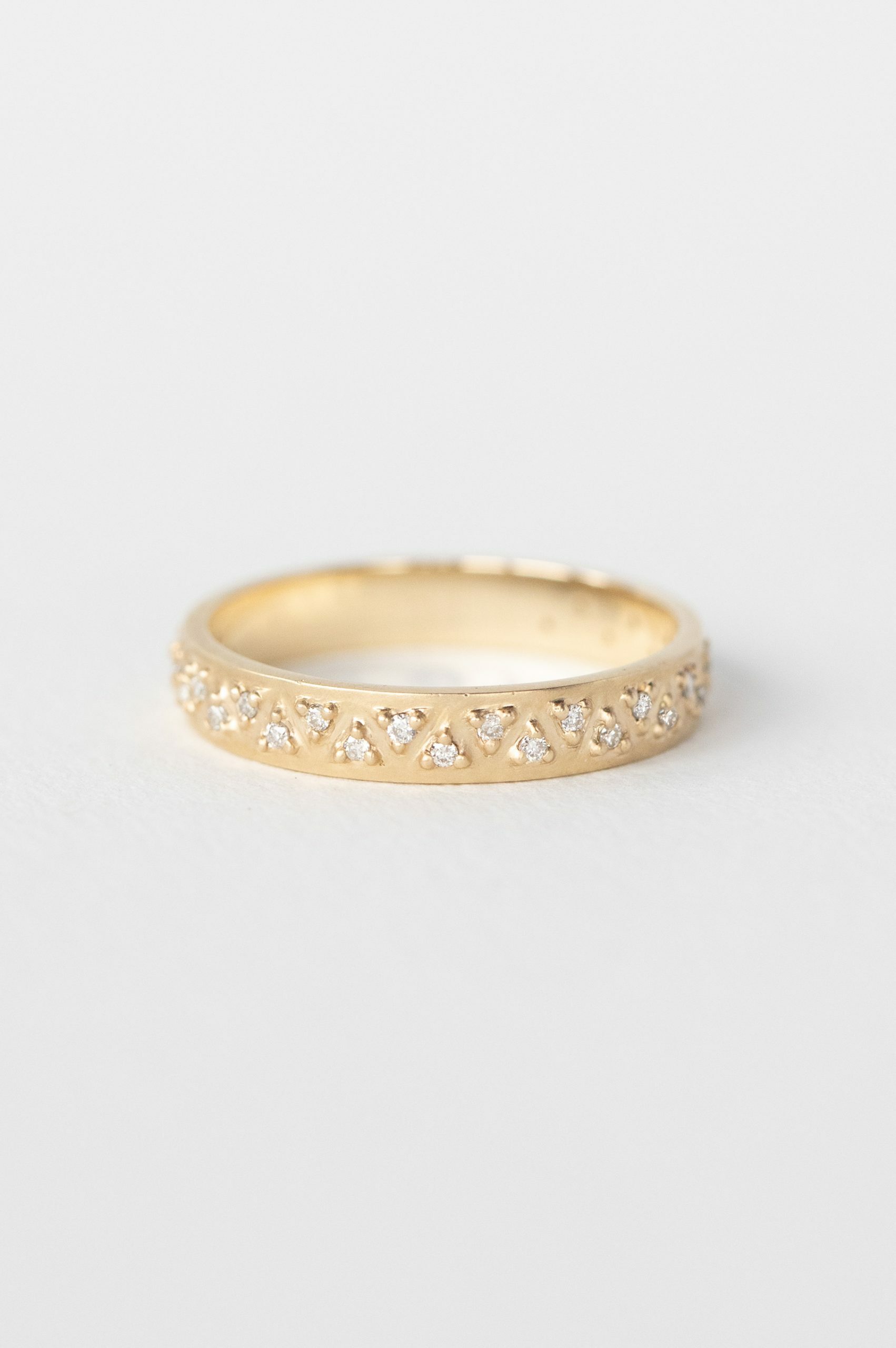 Yellow gold wide band ring multiple triangle diamond geometric pavé setting Celine Daoust