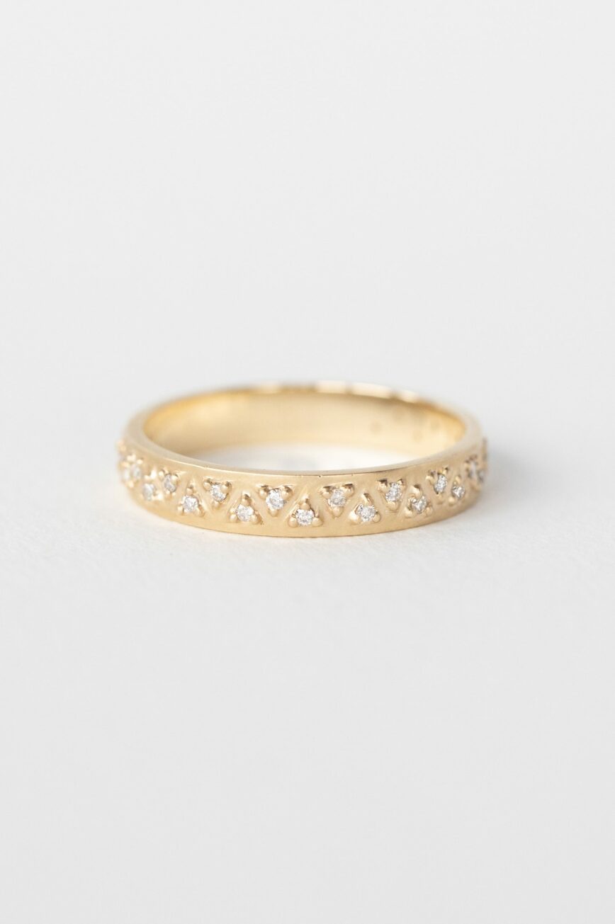 Yellow gold wide band ring multiple triangle diamond geometric pavé setting Celine Daoust