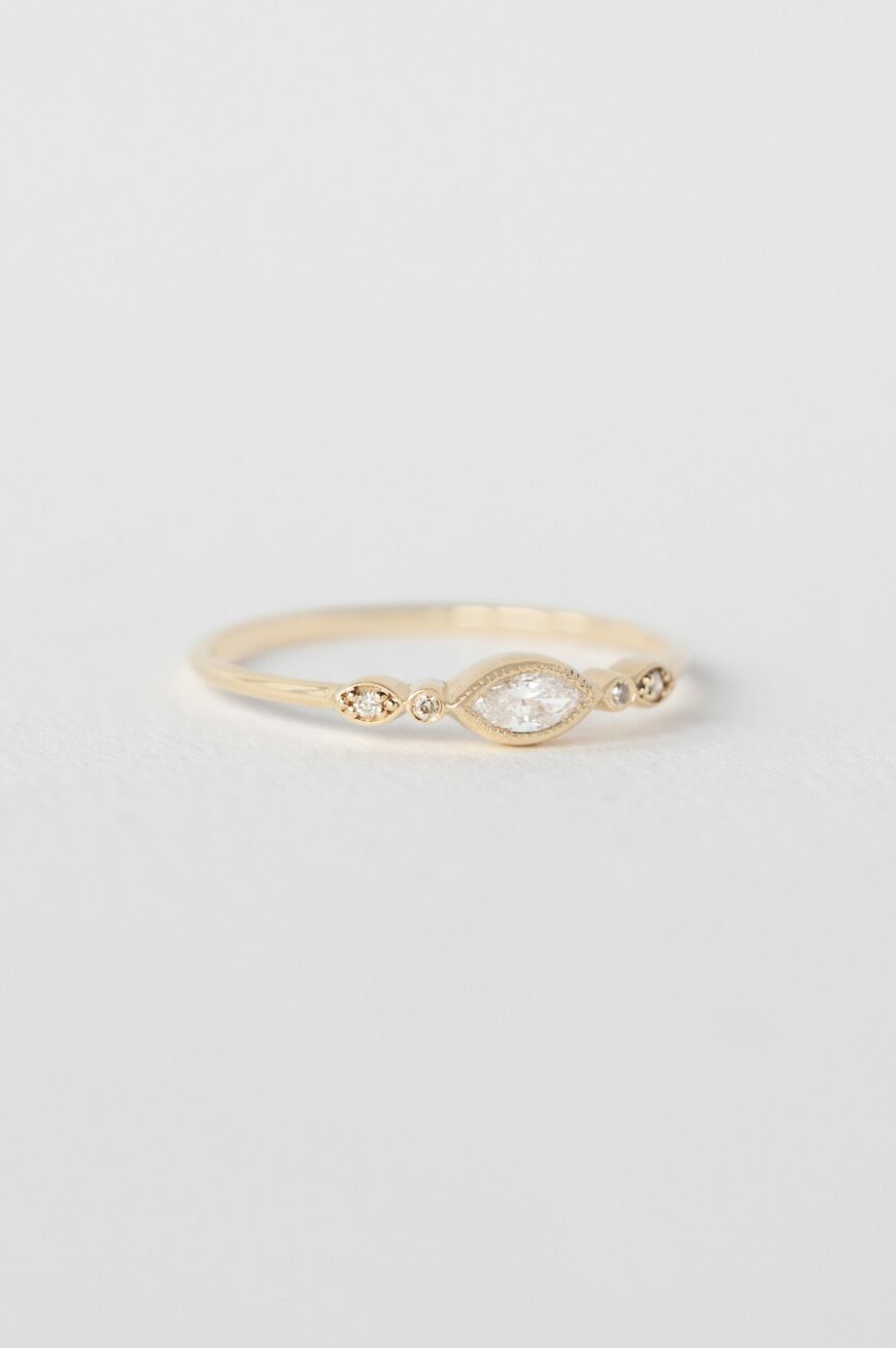 Yellow gold ring marquise diamond two diamond eye accent slim band Celine Daoust