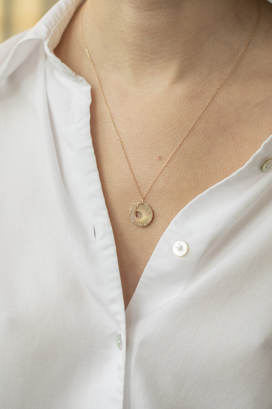 Yellow gold necklace round medal pendant sun moon motif diamond accents Celine Daoust