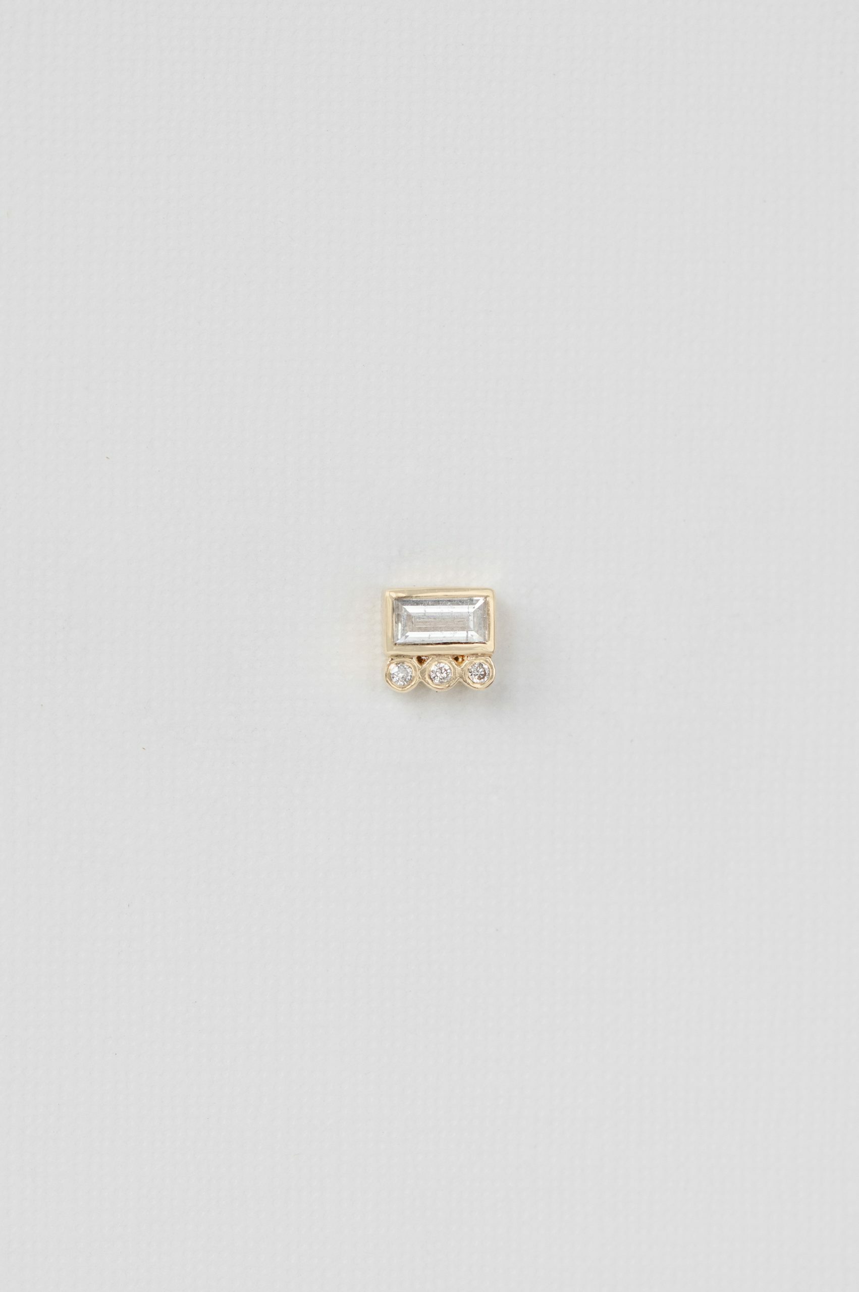 Yellow gold single stud earring baguette white diamond three diamond accent Celine Daoust
