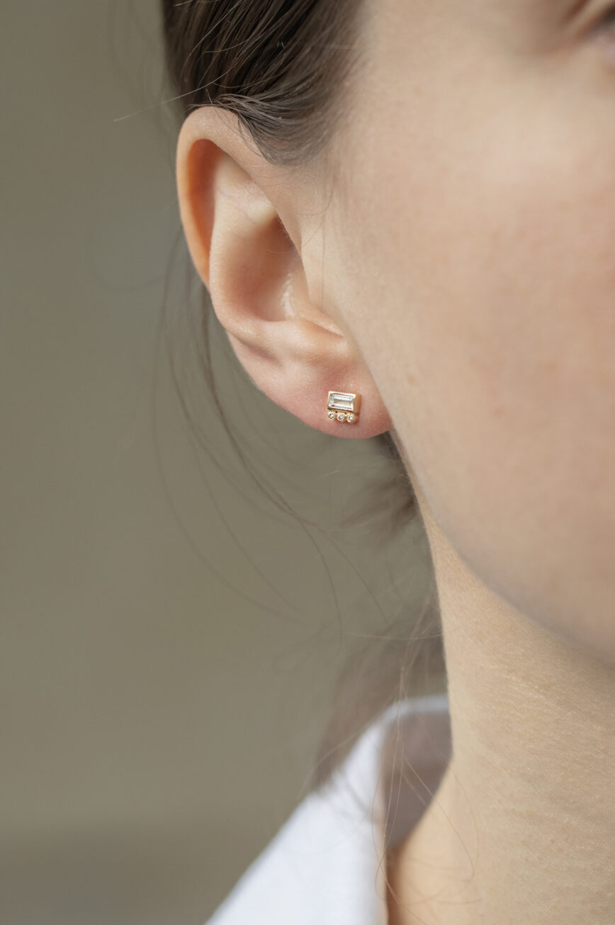 Yellow gold single stud earring baguette white diamond three diamond accent Celine Daoust