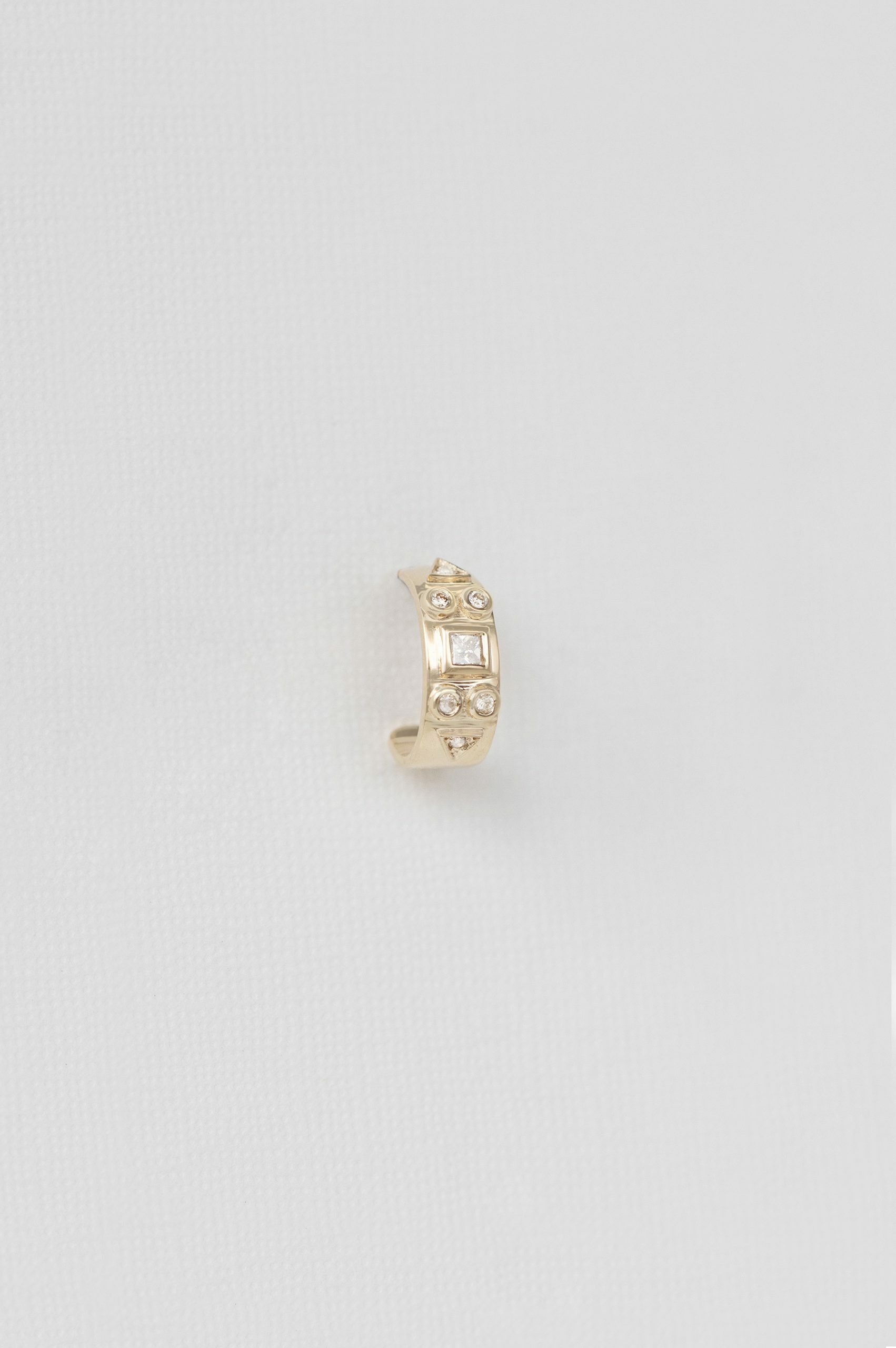 Yellow gold single hoop earring engraved totem diamond motif Celine Daoust