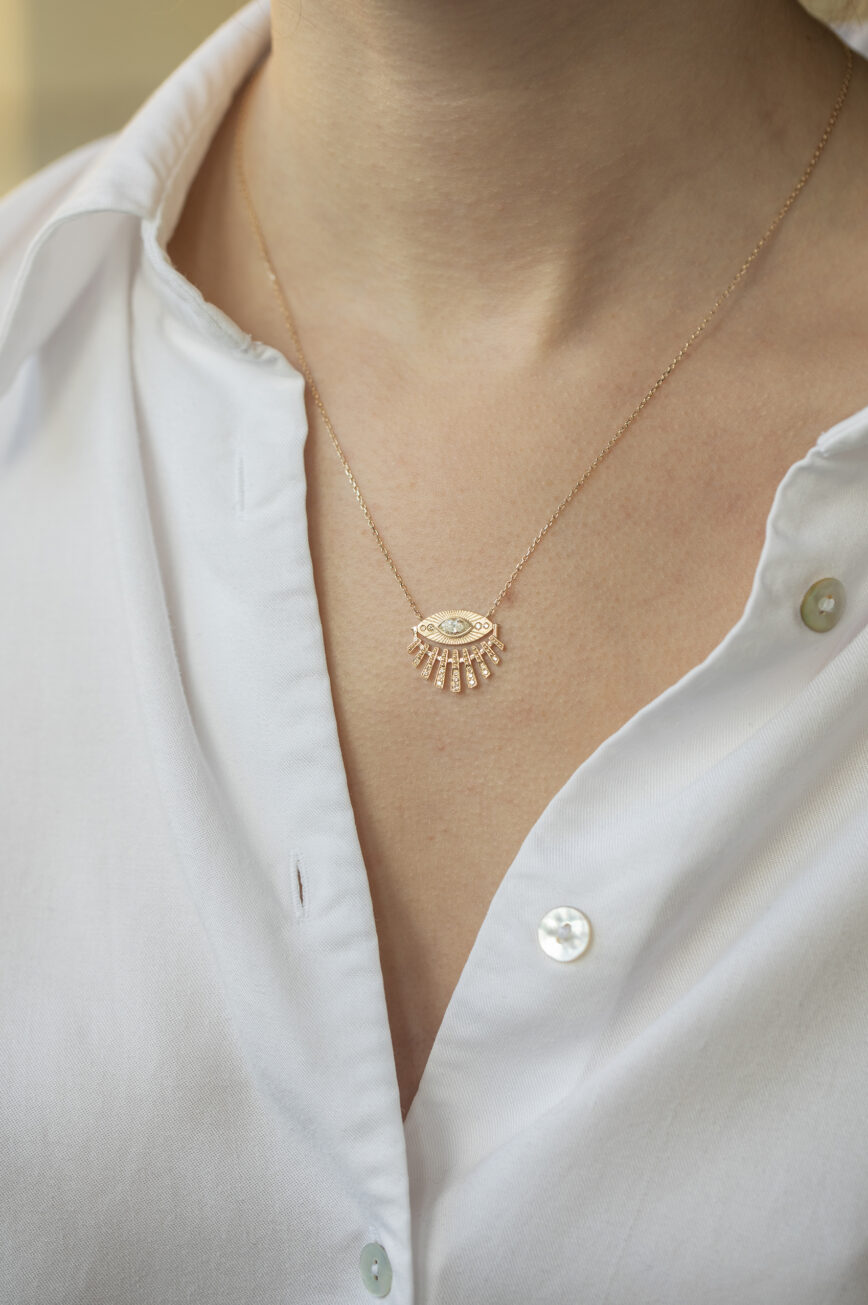 Yellow gold necklace open sun ray eye pendant diamond accents delicate chain Celine Daoust
