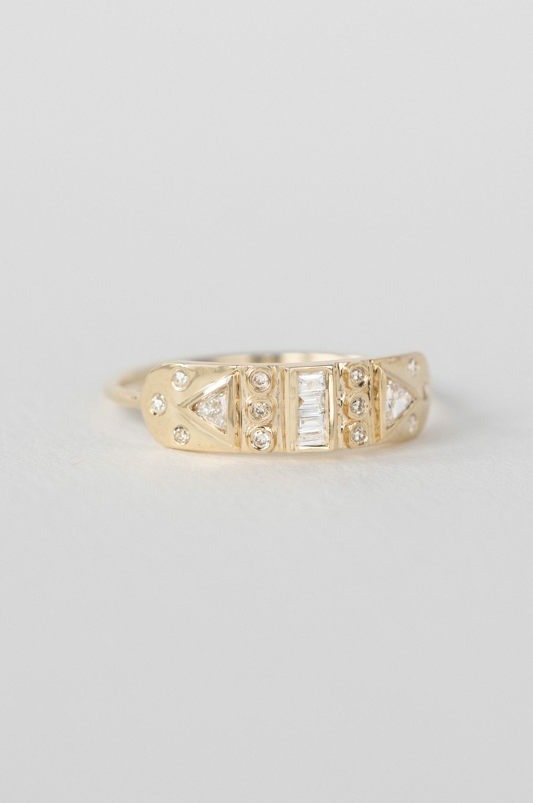 Yellow gold wide band ring baguette triangle diamond totem motifs Celine Daoust
