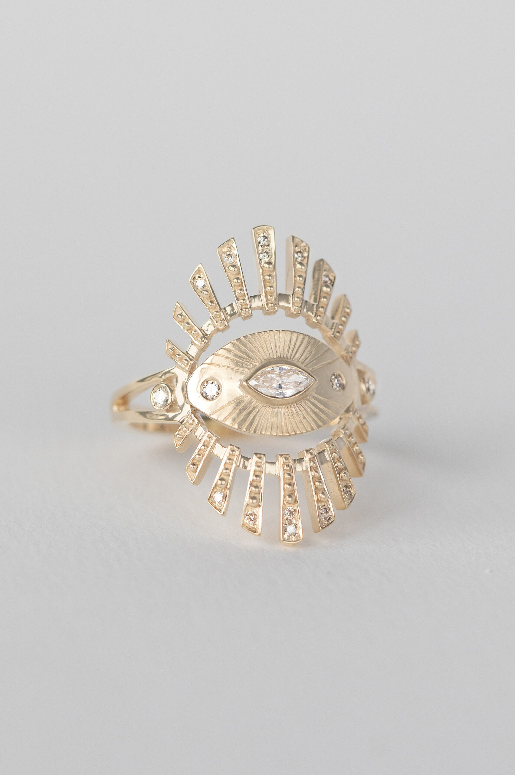 Yellow gold wide ring marquise diamond sun eye open beams pavé diamond Celine Daoust