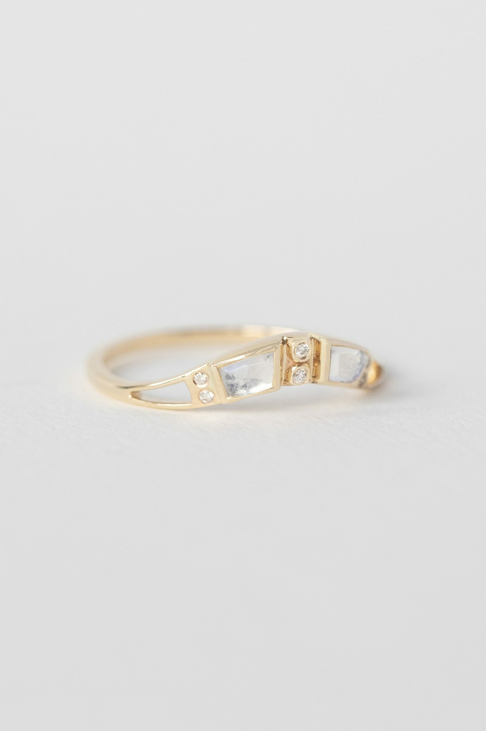 Gold curved band ring baguette moonstone diamond accents Céline Daoust