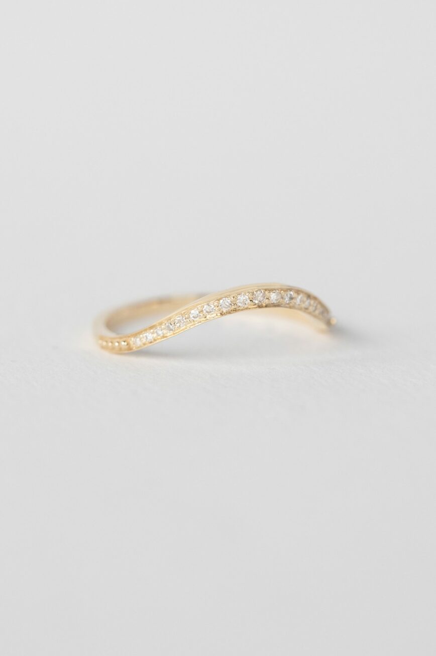 Yellow gold curved wave ring pavé diamond band Celine Daoust