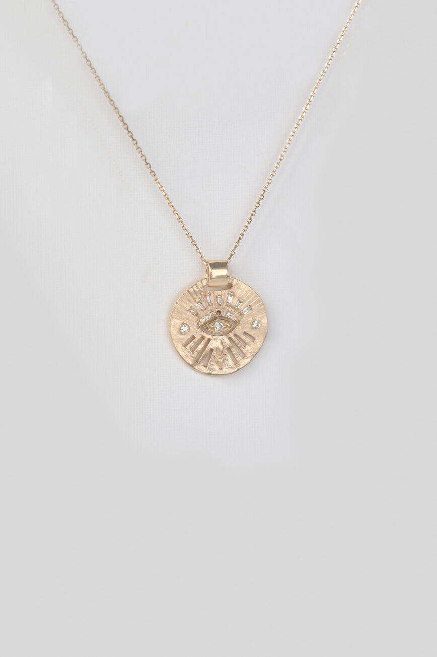 Yellow gold necklace round medal pendant diamond eye motif dangling chain Celine Daoust