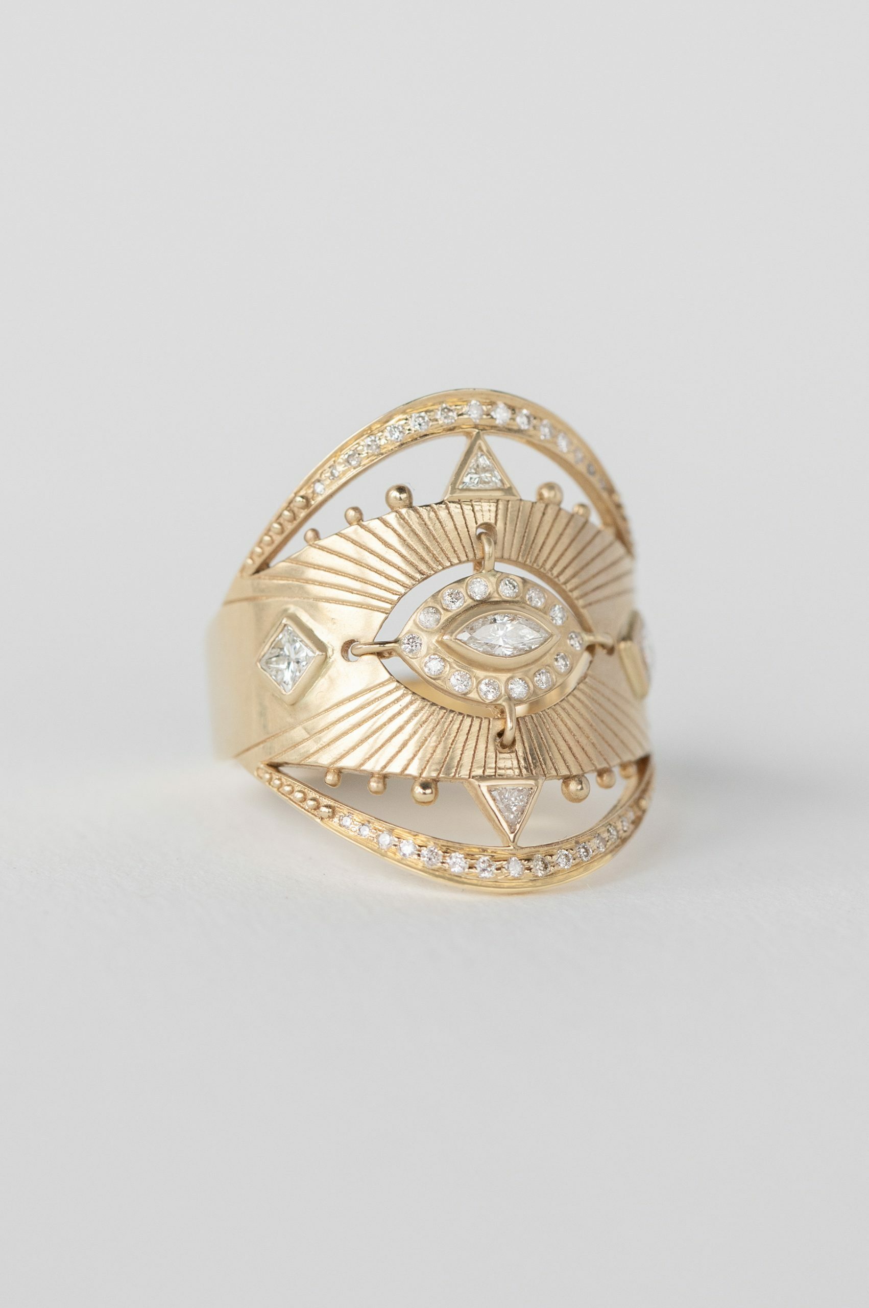 Yellow gold wide ring marquise diamond sun ray open eye pavé diamond frame Celine Daoust