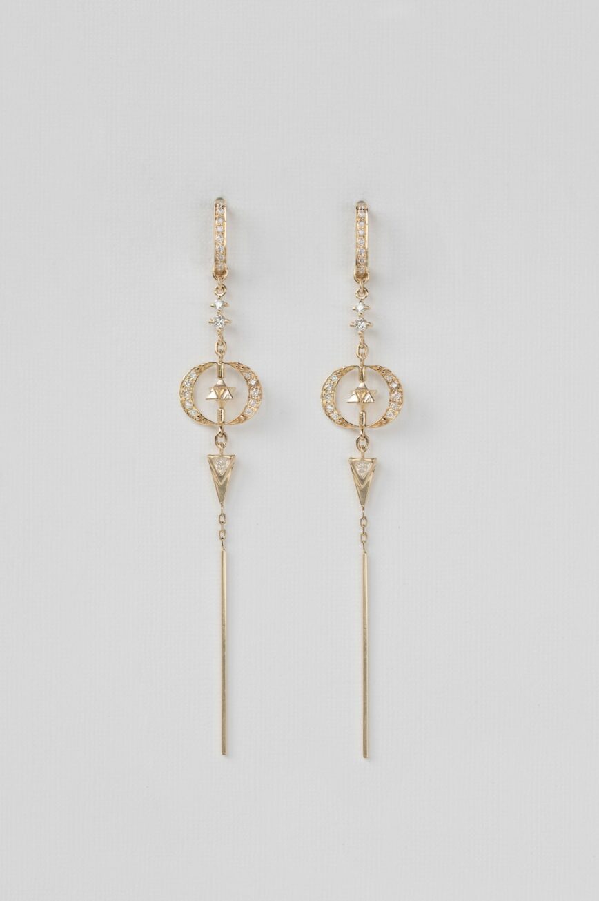 Yellow gold long drop earrings moon merkabah diamond charms worn on ear Celine Daoust