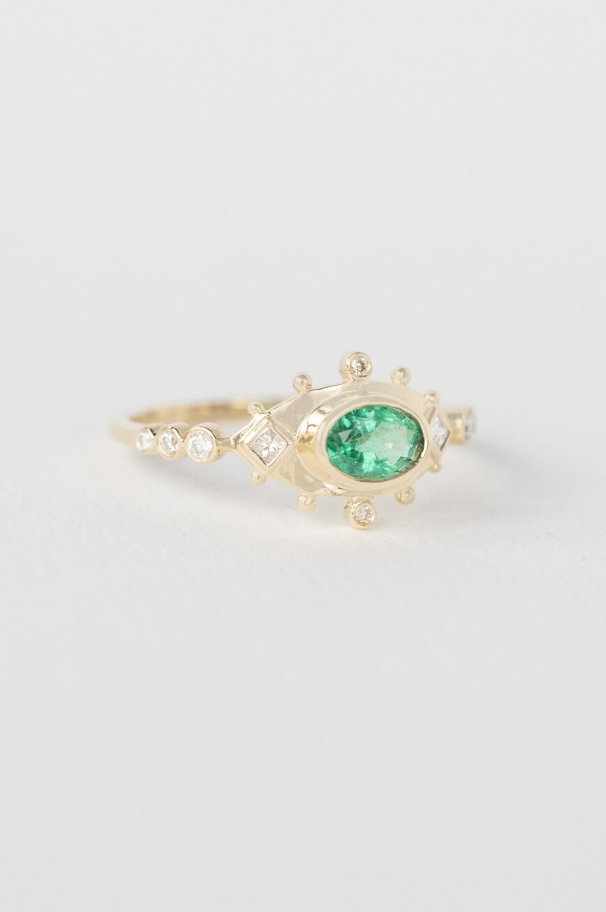 Yellow gold ring marquise emerald diamond eye motif accents Celine Daoust
