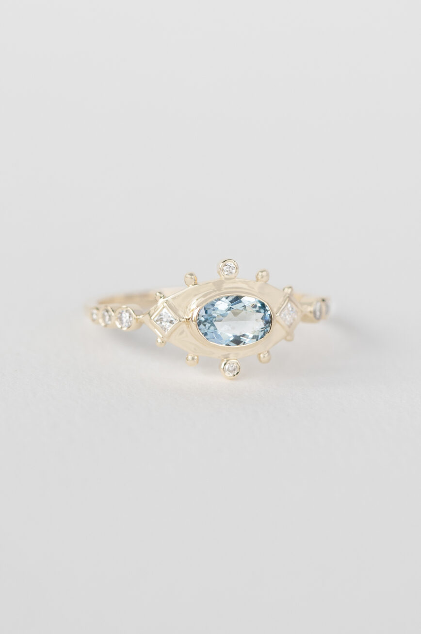 Yellow gold ring oval aquamarine diamond eye motif accents Celine Daoust