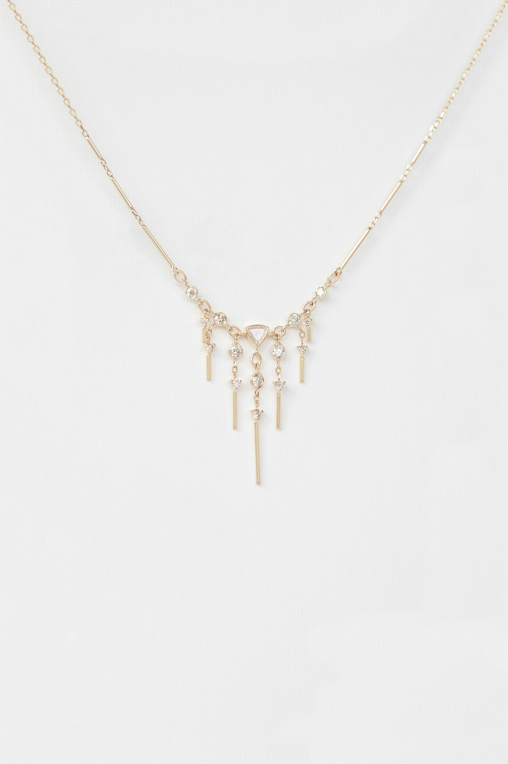 Gold necklace triangle pendant dangling diamond bar drops Celine Daoust