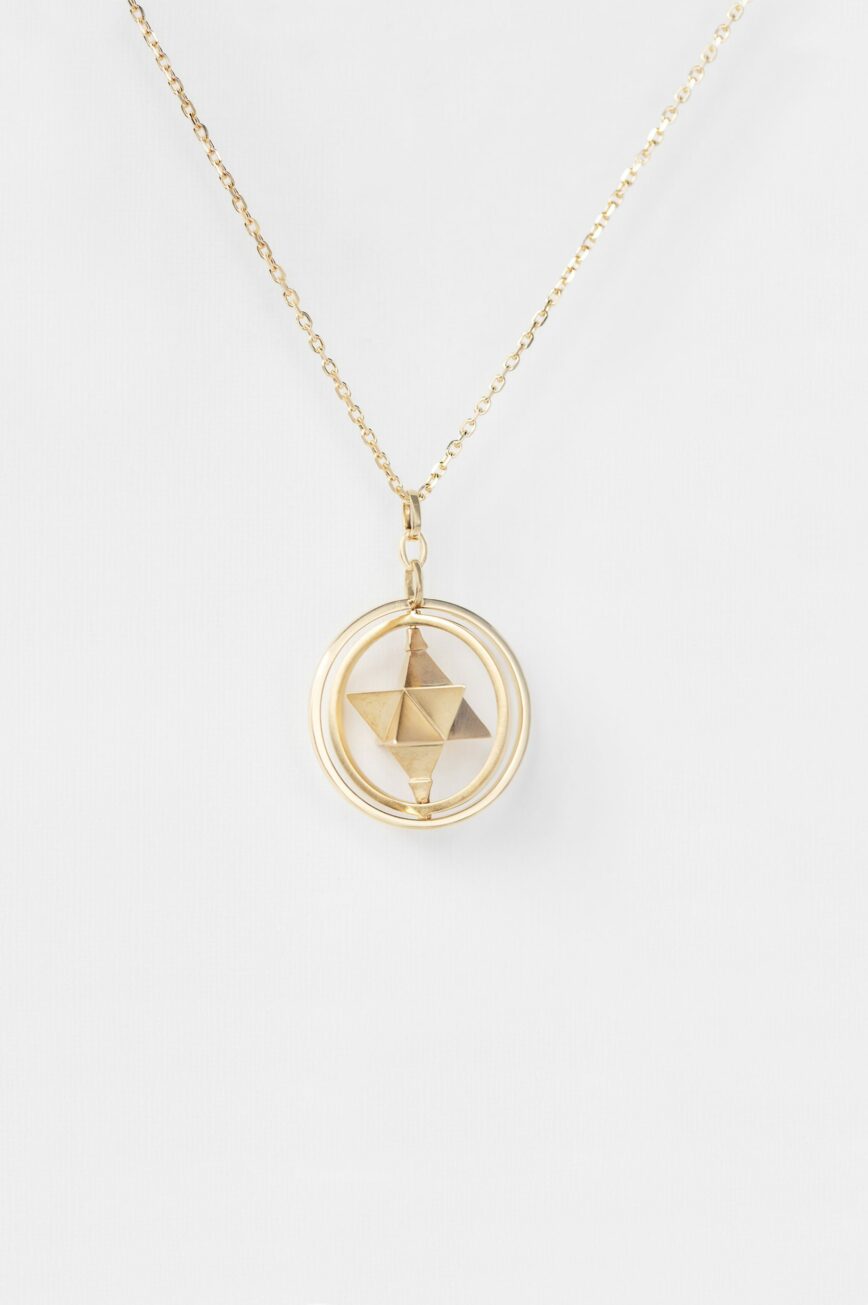 Yellow gold necklace moving merkabah star geometric pendant chain Celine Daoust