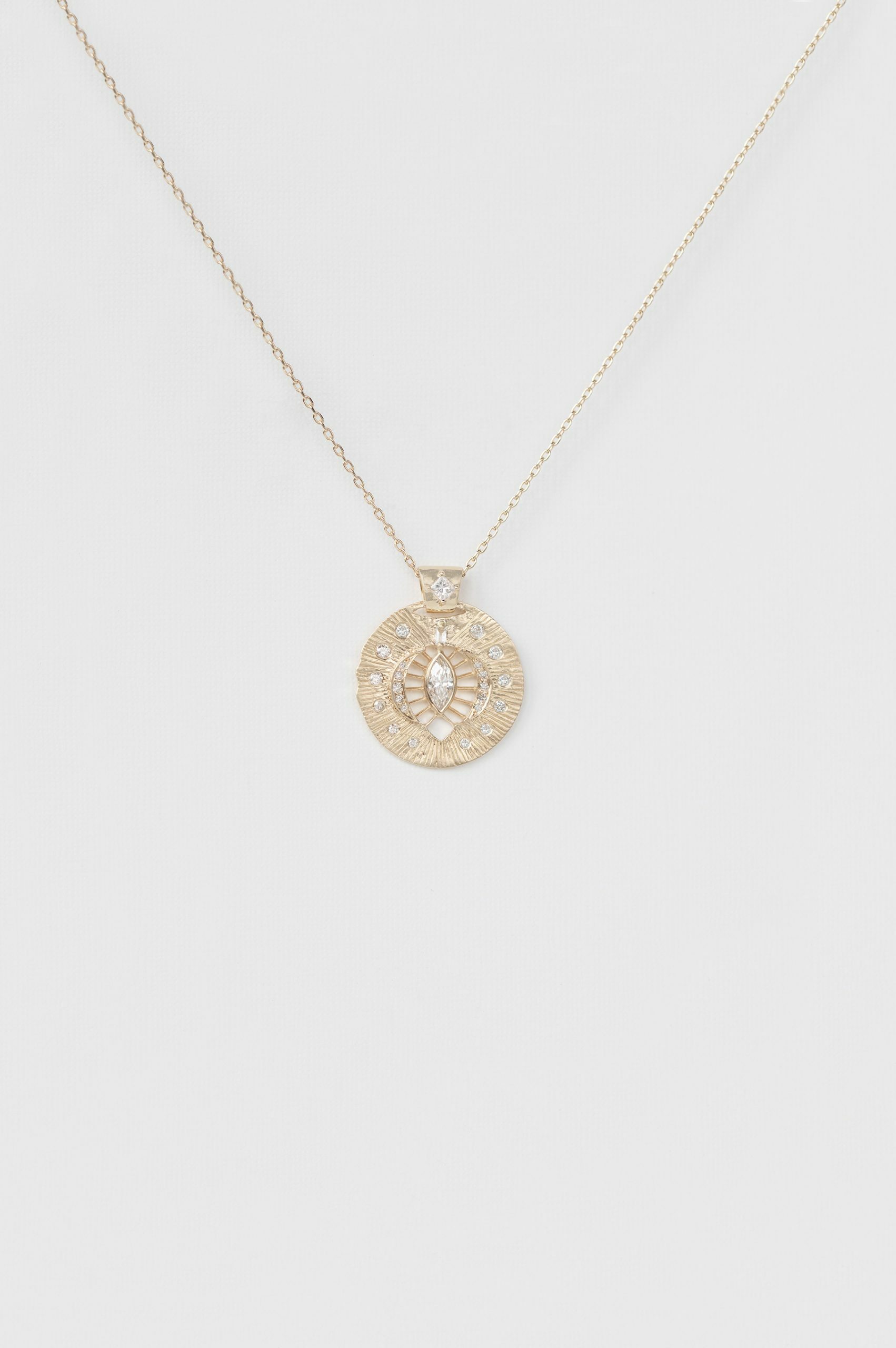 Yellow gold necklace round engraved disc pendant marquise diamond eye motif Celine Daoust