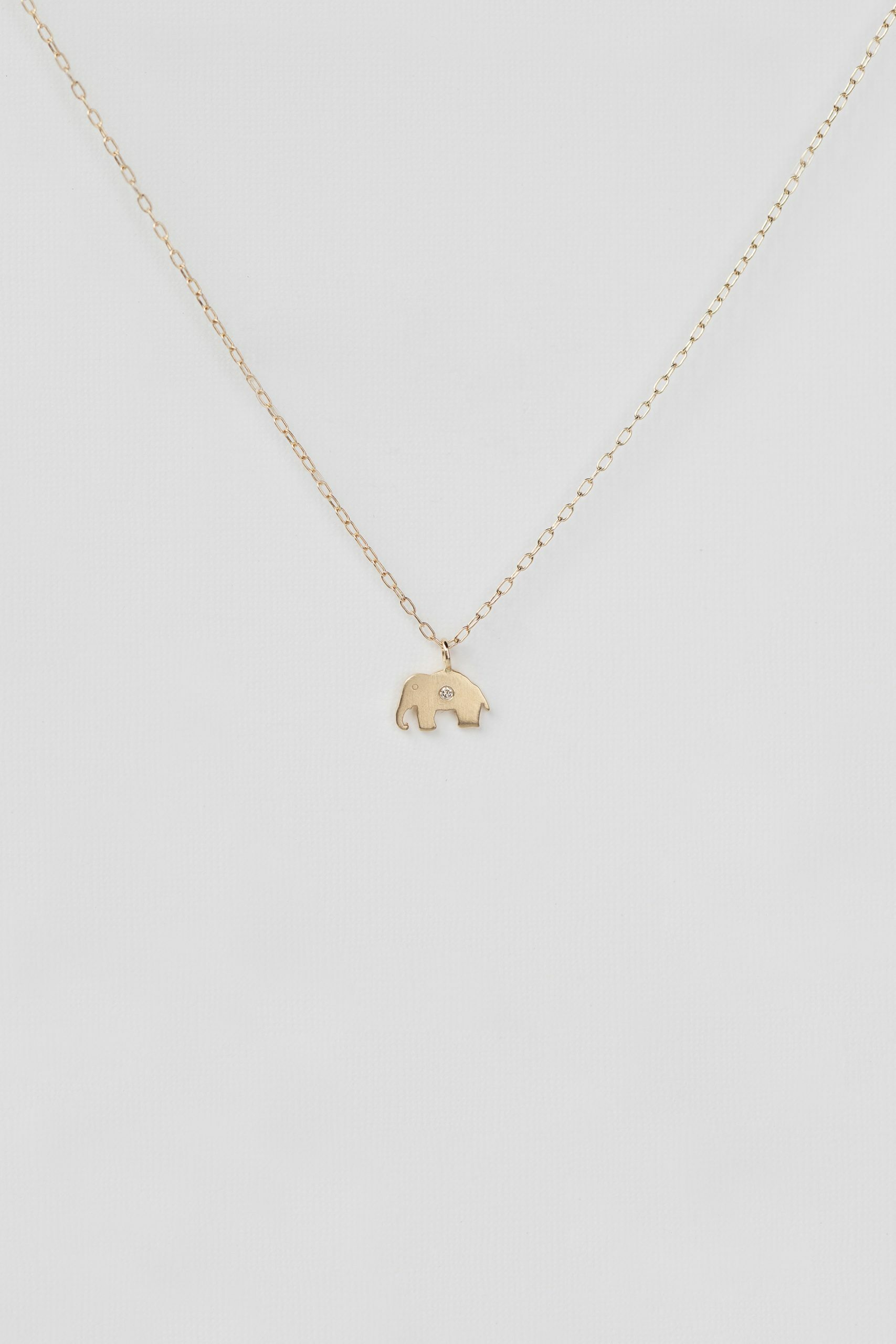 Gold necklace small elephant charm pendant delicate chain Celine Daoust