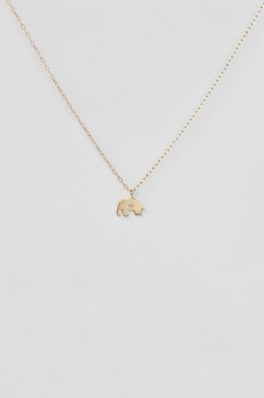 Gold necklace small elephant charm pendant delicate chain Celine Daoust