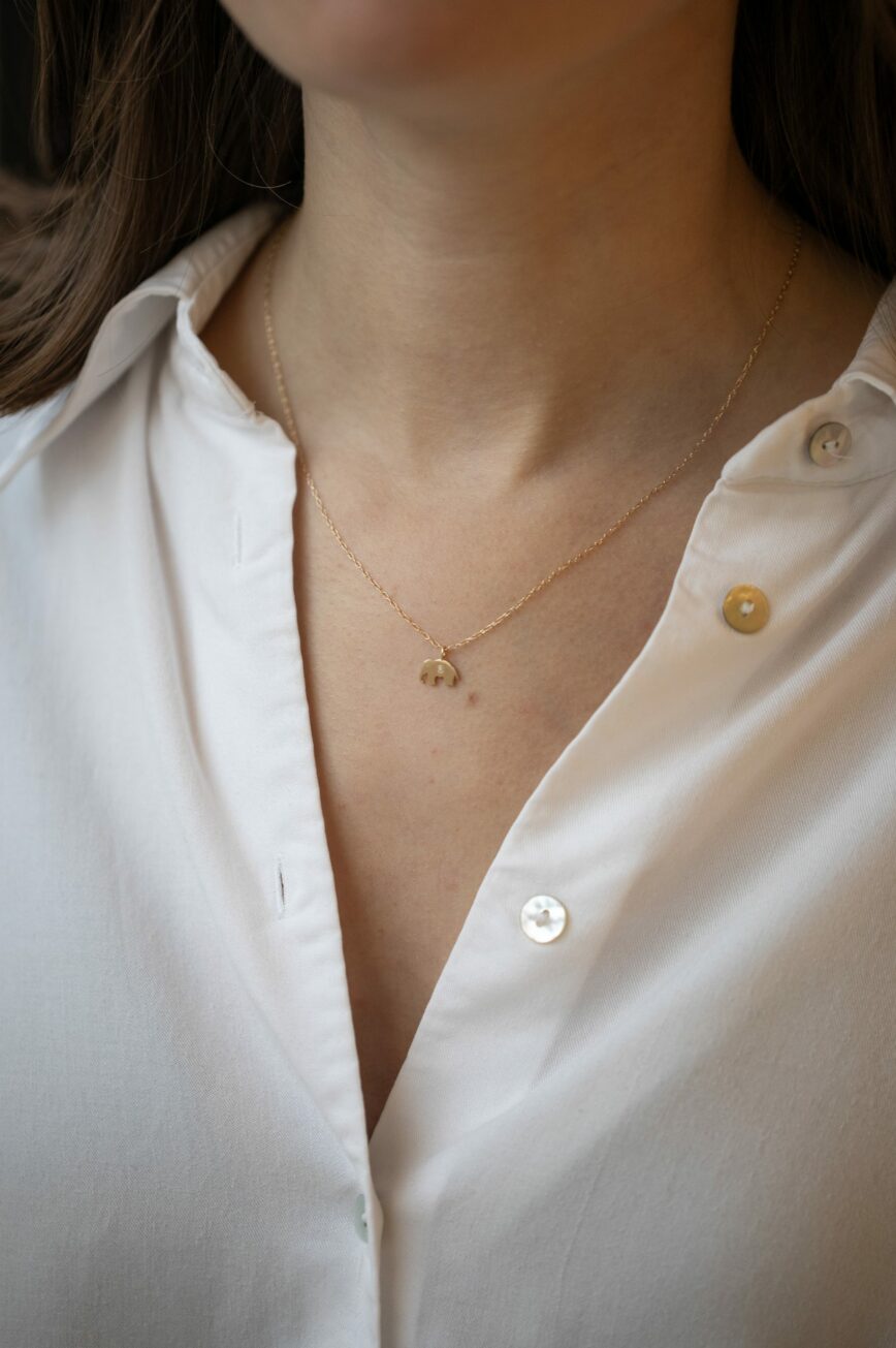Gold necklace small elephant charm pendant delicate chain Celine Daoust