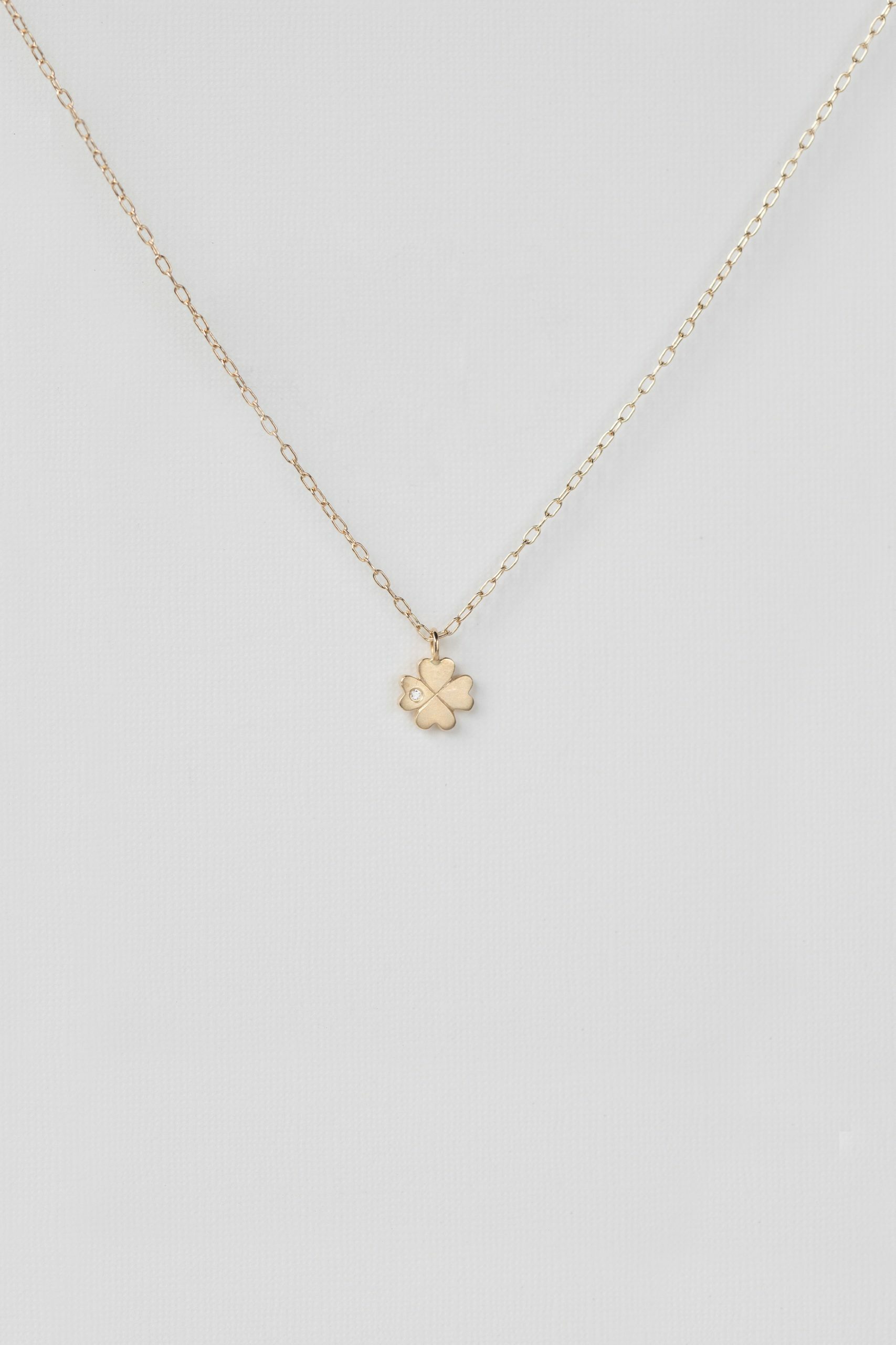 Gold necklace four-leaf clover charm pendant delicate chain Celine Daoust