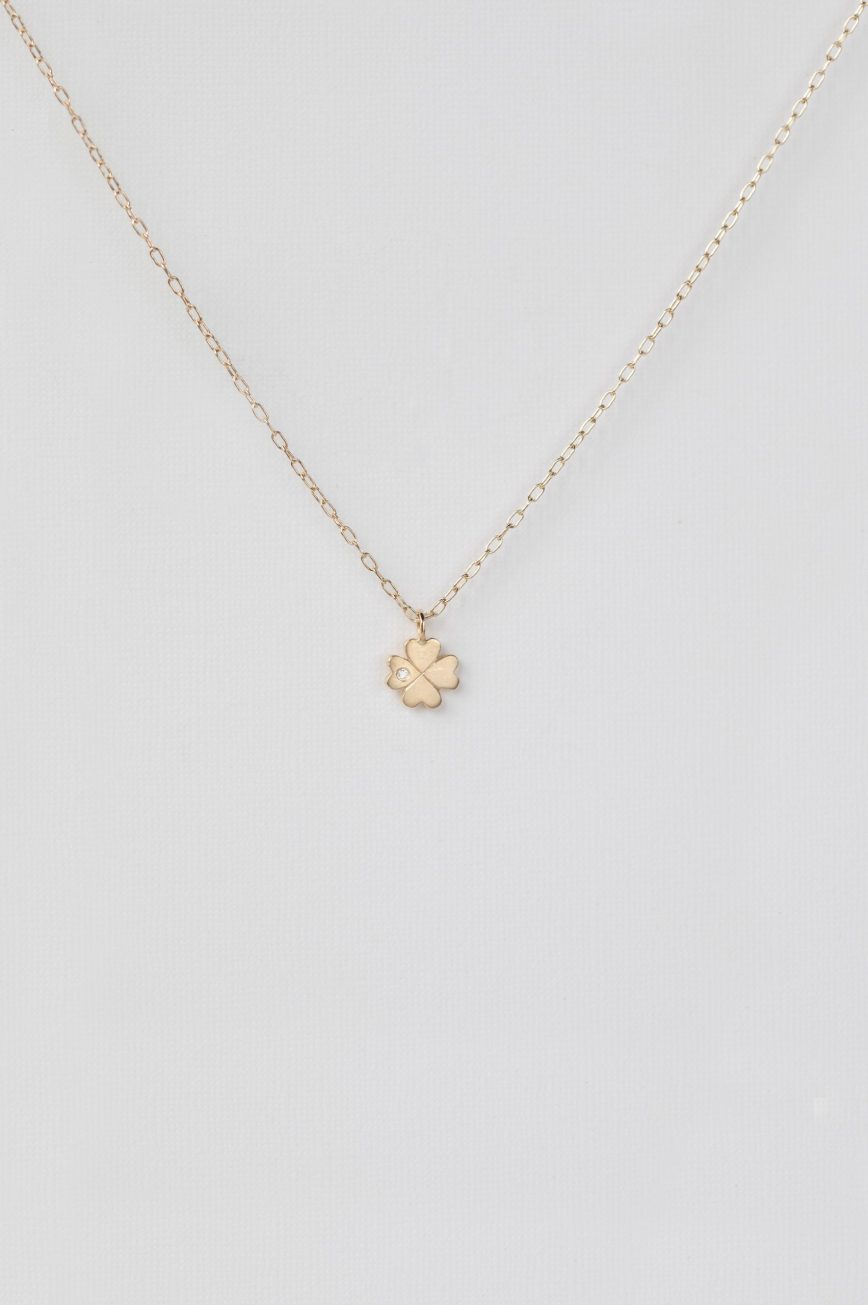 Gold necklace four-leaf clover charm pendant delicate chain Celine Daoust