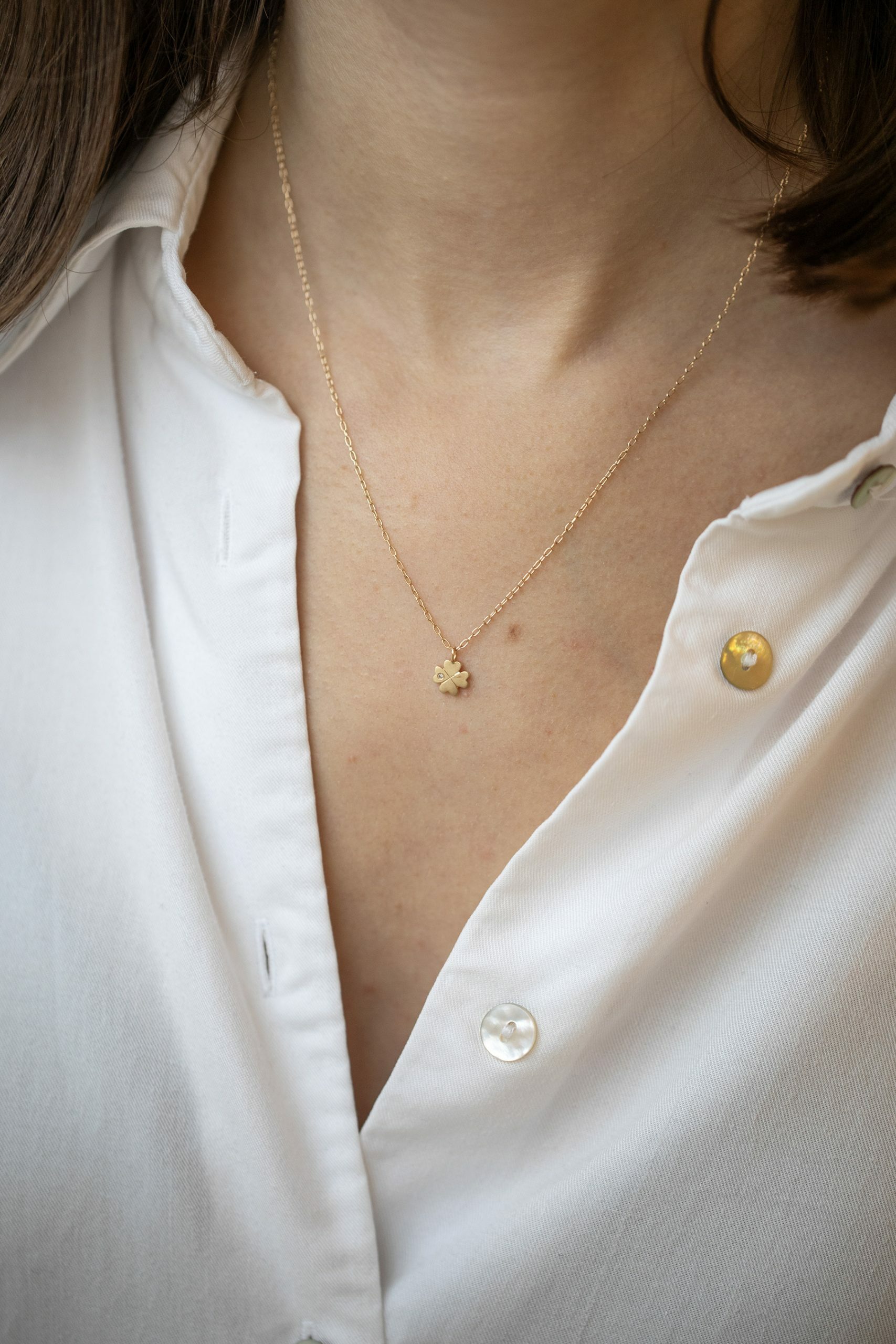 Gold necklace four-leaf clover charm pendant delicate chain Celine Daoust