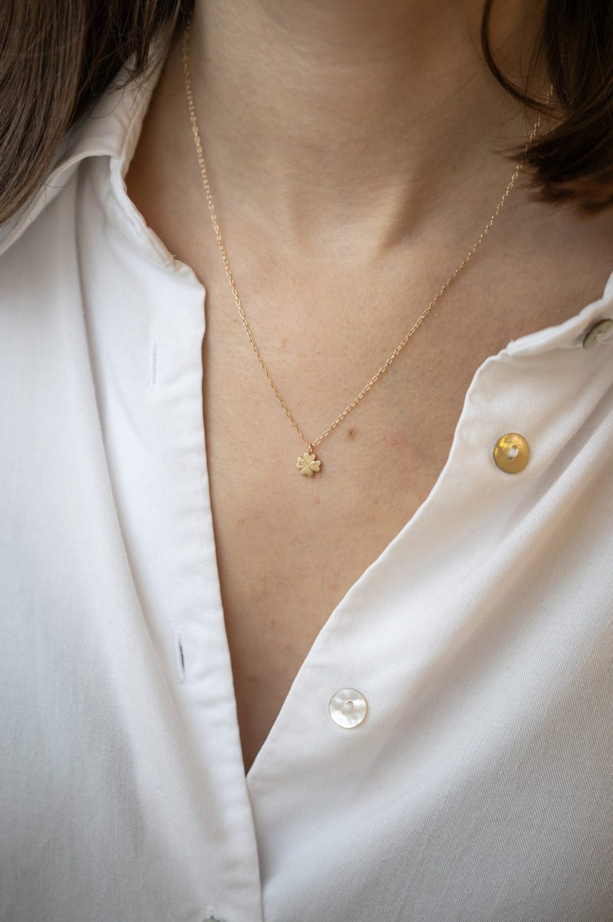 Gold necklace four-leaf clover charm pendant delicate chain Celine Daoust