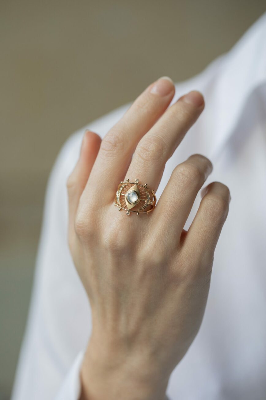 Yellow gold wide ring round moonstone open geometric eye filigree frame Celine Daoust