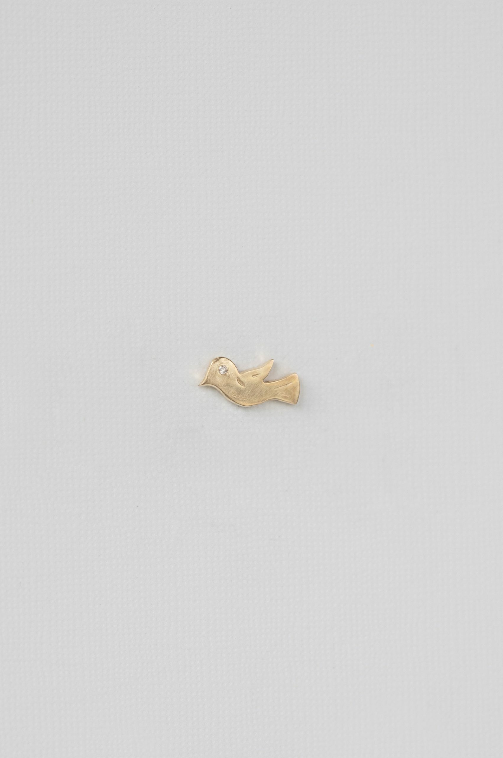 Yellow gold single stud earring sculpted bird motif Celine Daoust