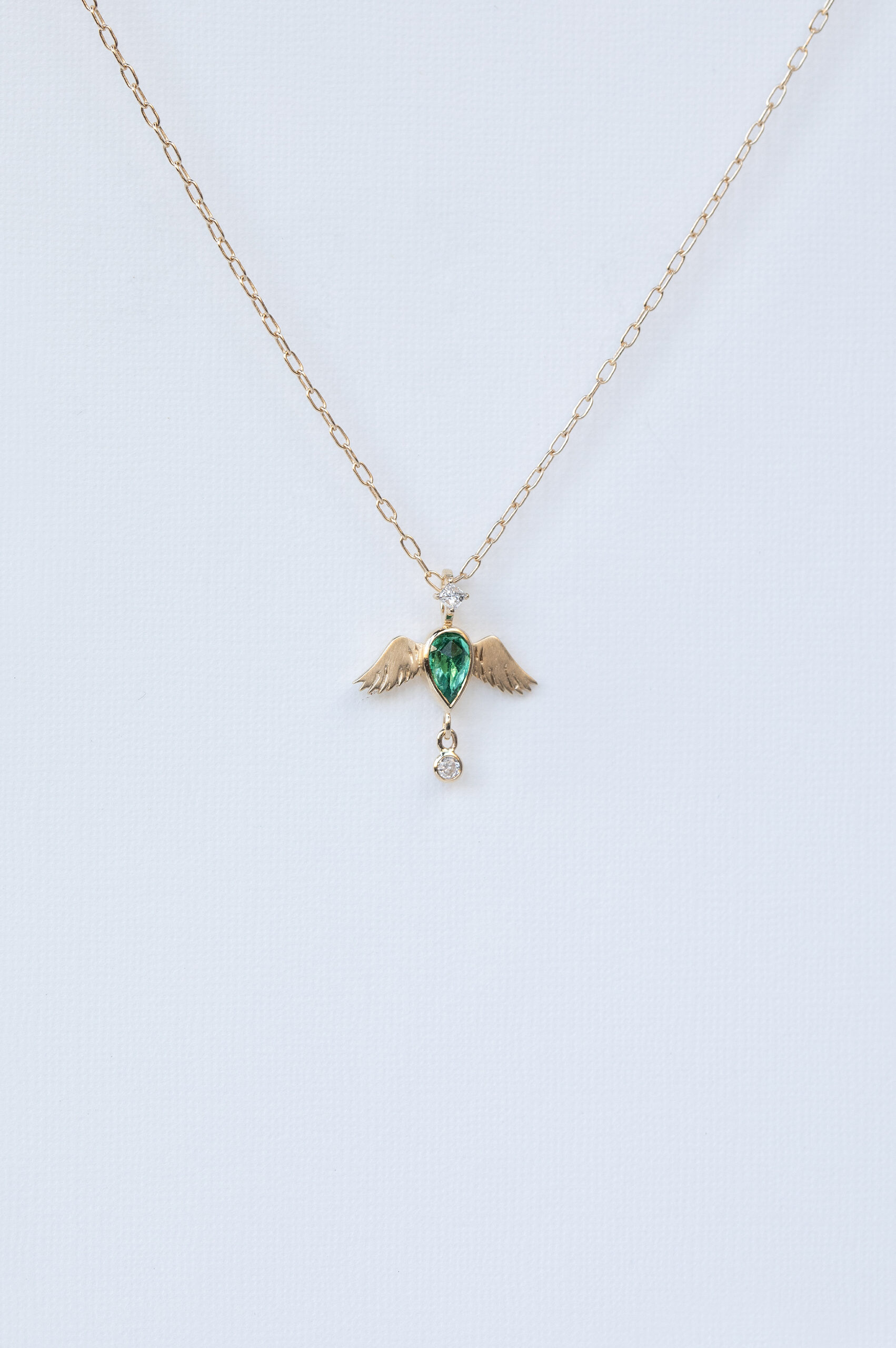 Yellow gold necklace pear emerald angel wings diamond pendant Celine Daoust