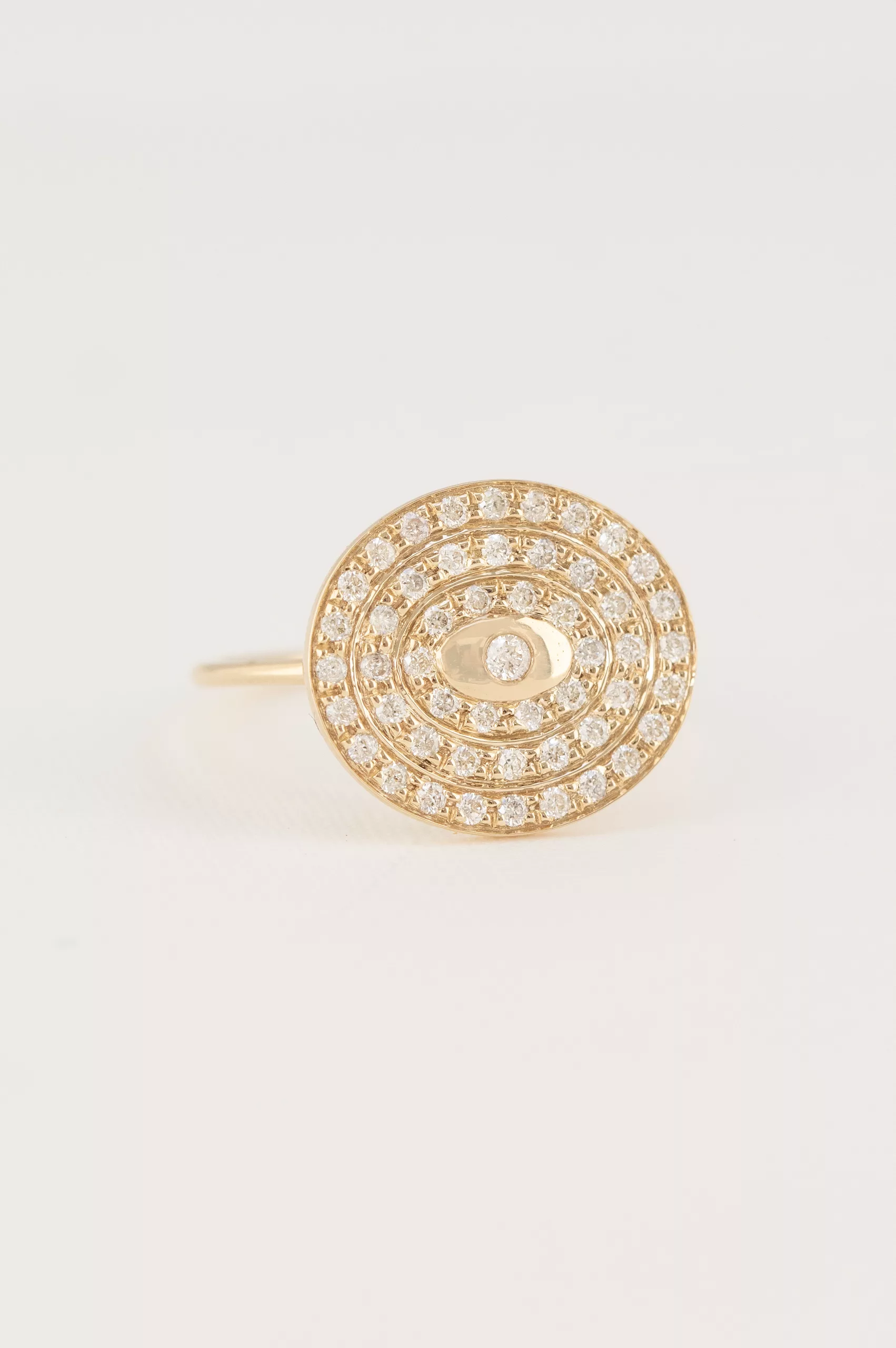 Yellow gold wide ring circular pavé diamond disc eye motif Celine Daoust
