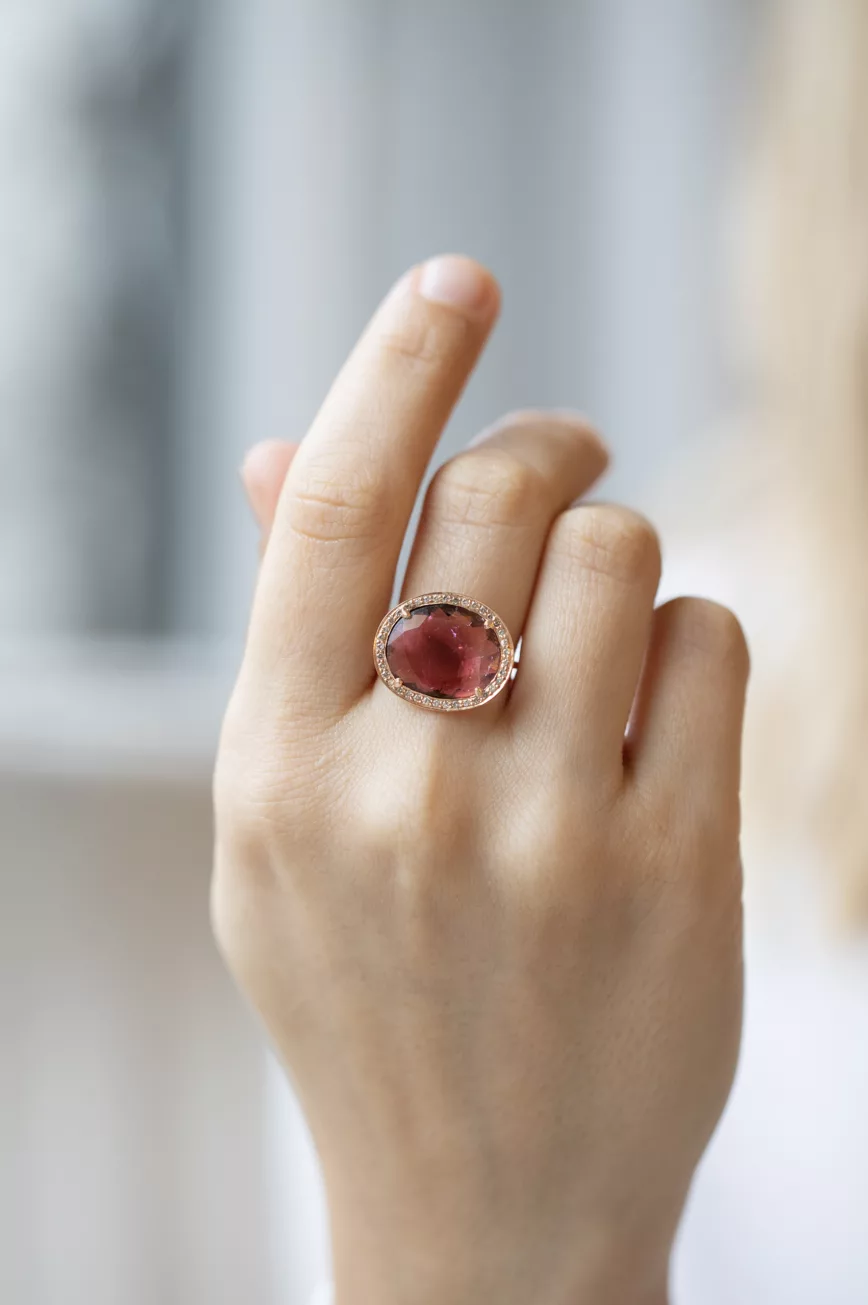 Rose gold ring oval pink tourmaline pavé diamond halo worn on hand Celine Daoust